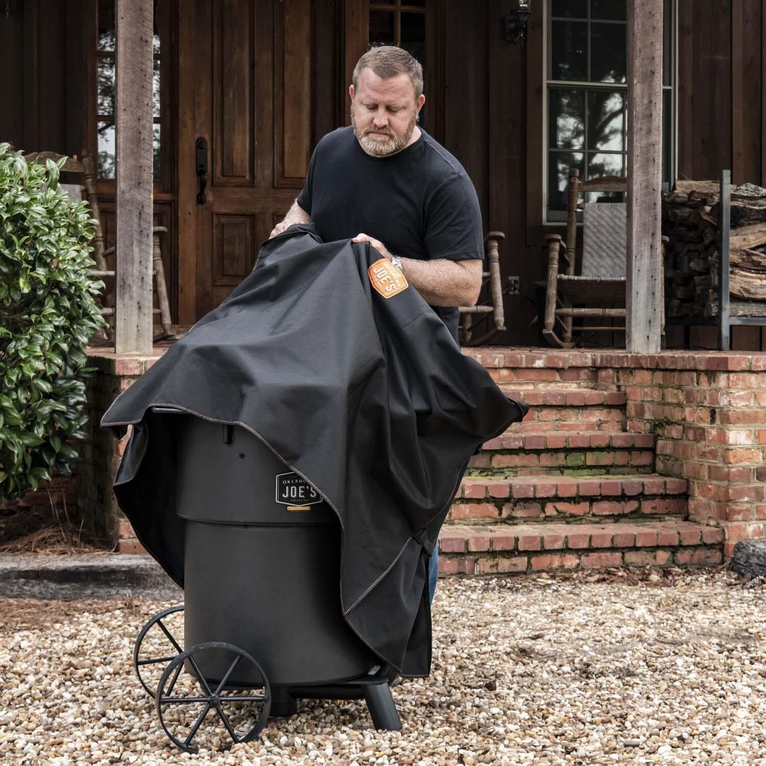 Oklahoma Joe's 8788124P04 Bronco Drum Smoker Cover - Removing Cover - Lifestyle thumbnail