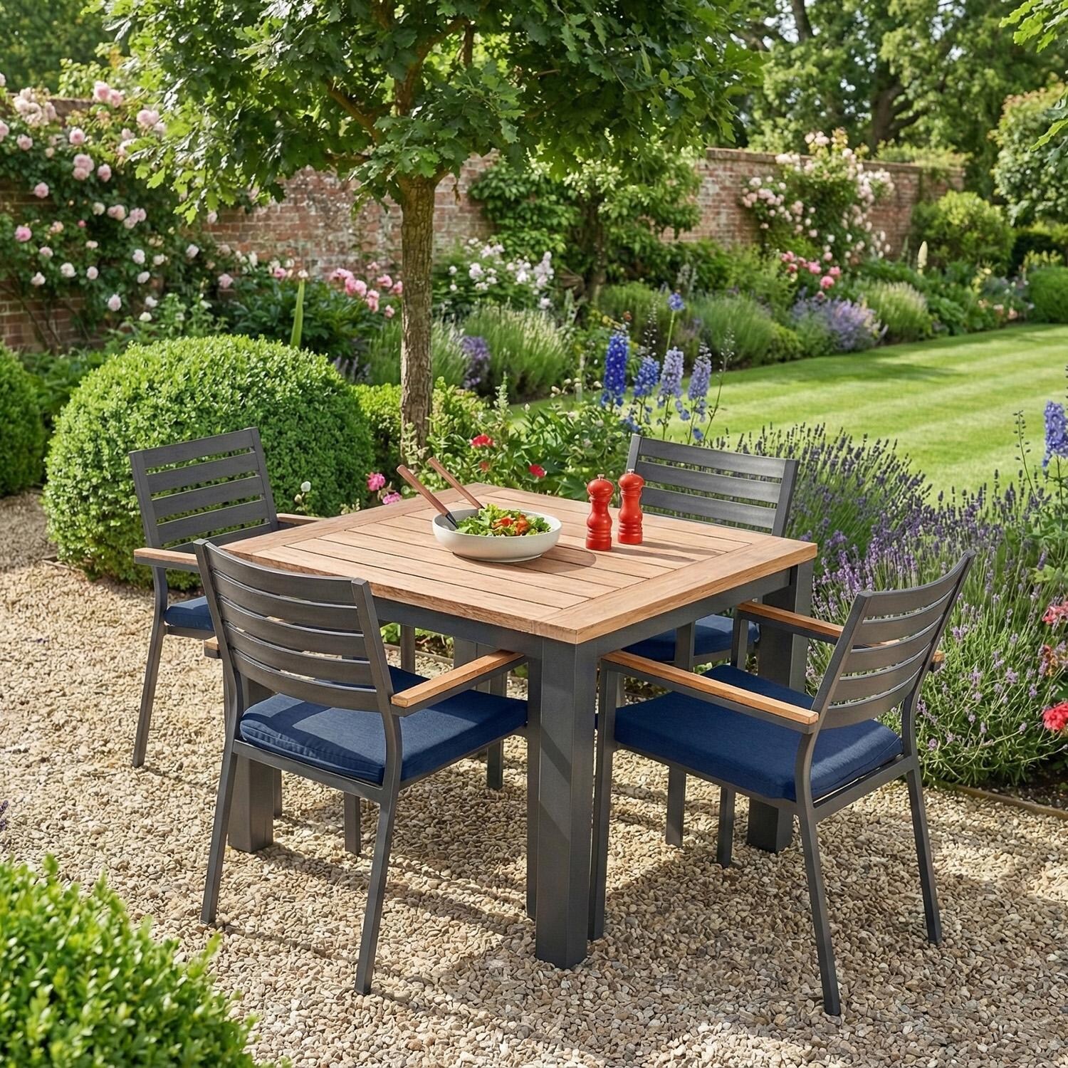 Elba 5 Pc Aluminum Dining Set w/ Teak Tabletop in Charcoal / Spectrum Indigo - In Garden - Lifestyle thumbnail