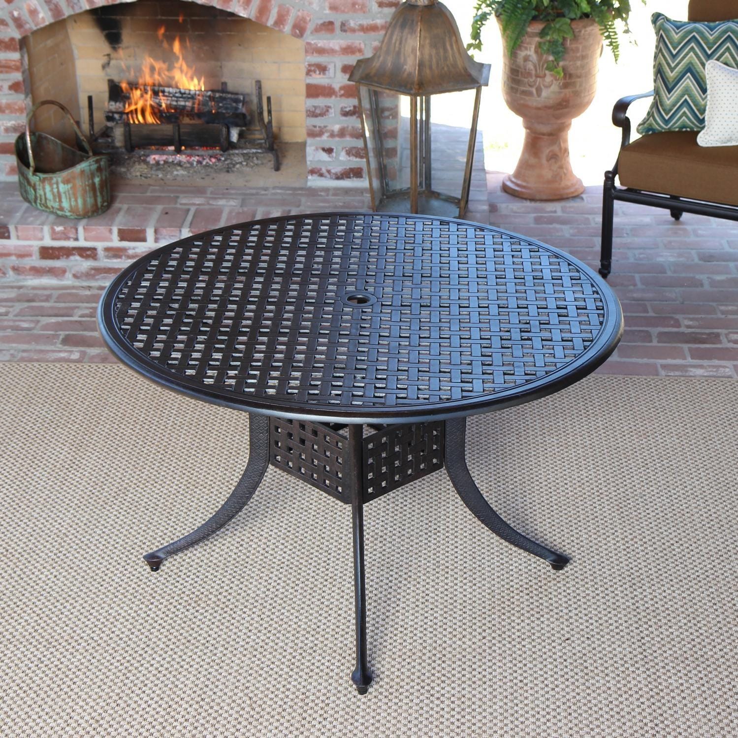 Acadia 7 Piece Sling Patio Dining Set With Swivel Rockers And 60 Inch Cast Aluminum Patio Dining Table