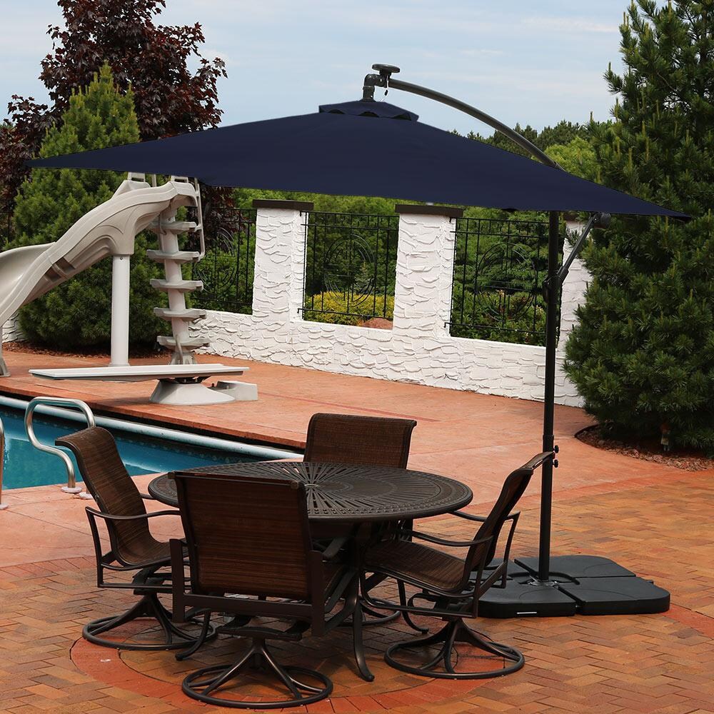 Ultimate Patio 10 Ft. Solar Lighted Octagonal Patio Cantilever Umbrella W/ Crank - Navy Blue - Lifestyle View thumbnail