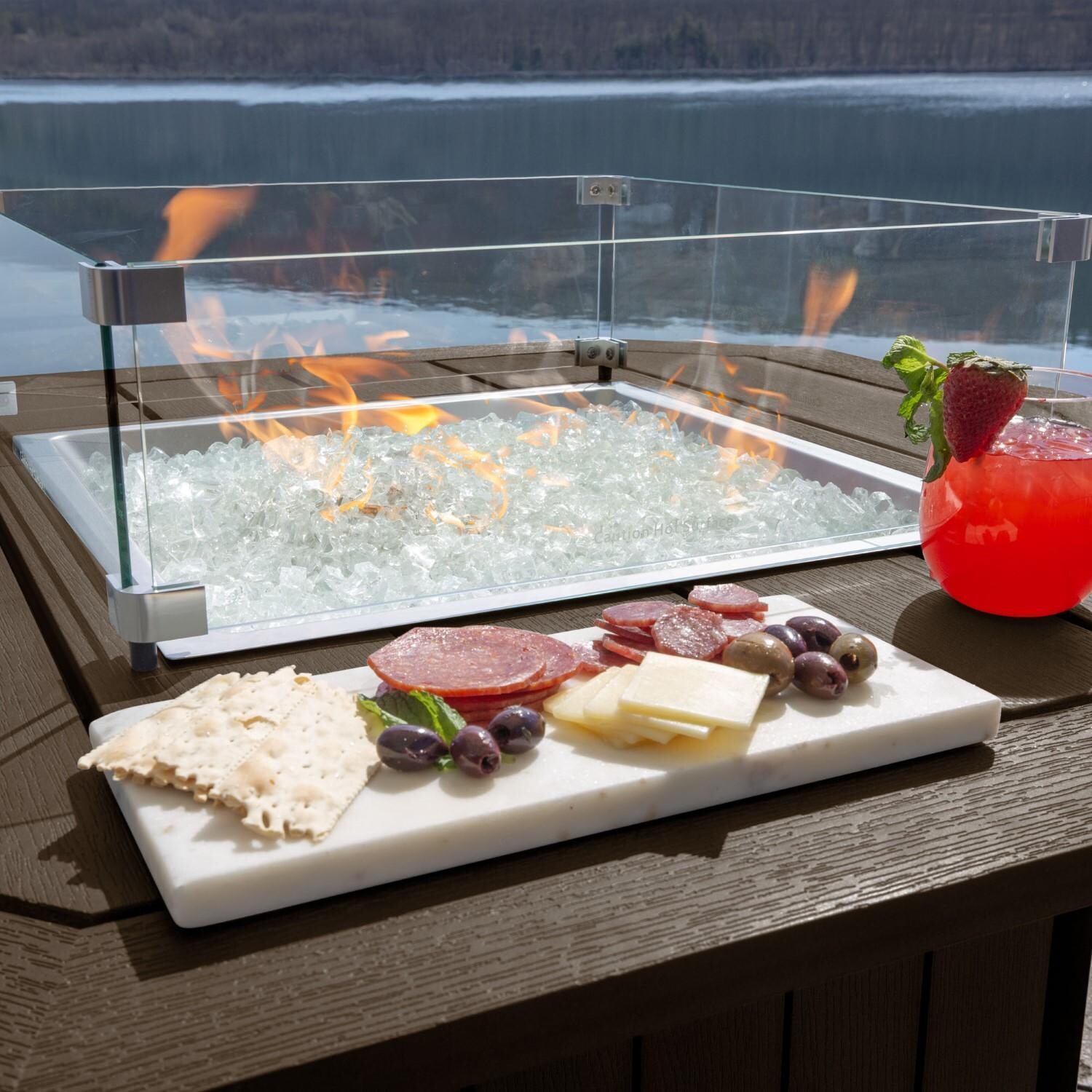 Harborview Octagonal Fire Pit Table in Weathered Acorn by Lakeview Outdoor Designs - In Use - Charcuterie Board - Lifestyle thumbnail