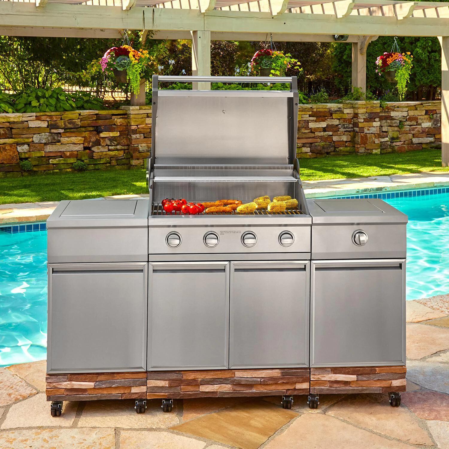 TYTUS TI404MGGLP Ash Stacked Stone 4-Burner Natural Gas Grill Island With Sear Burner & Ice Bucket (Ships as Propane with Conversion Fittings) - In Use