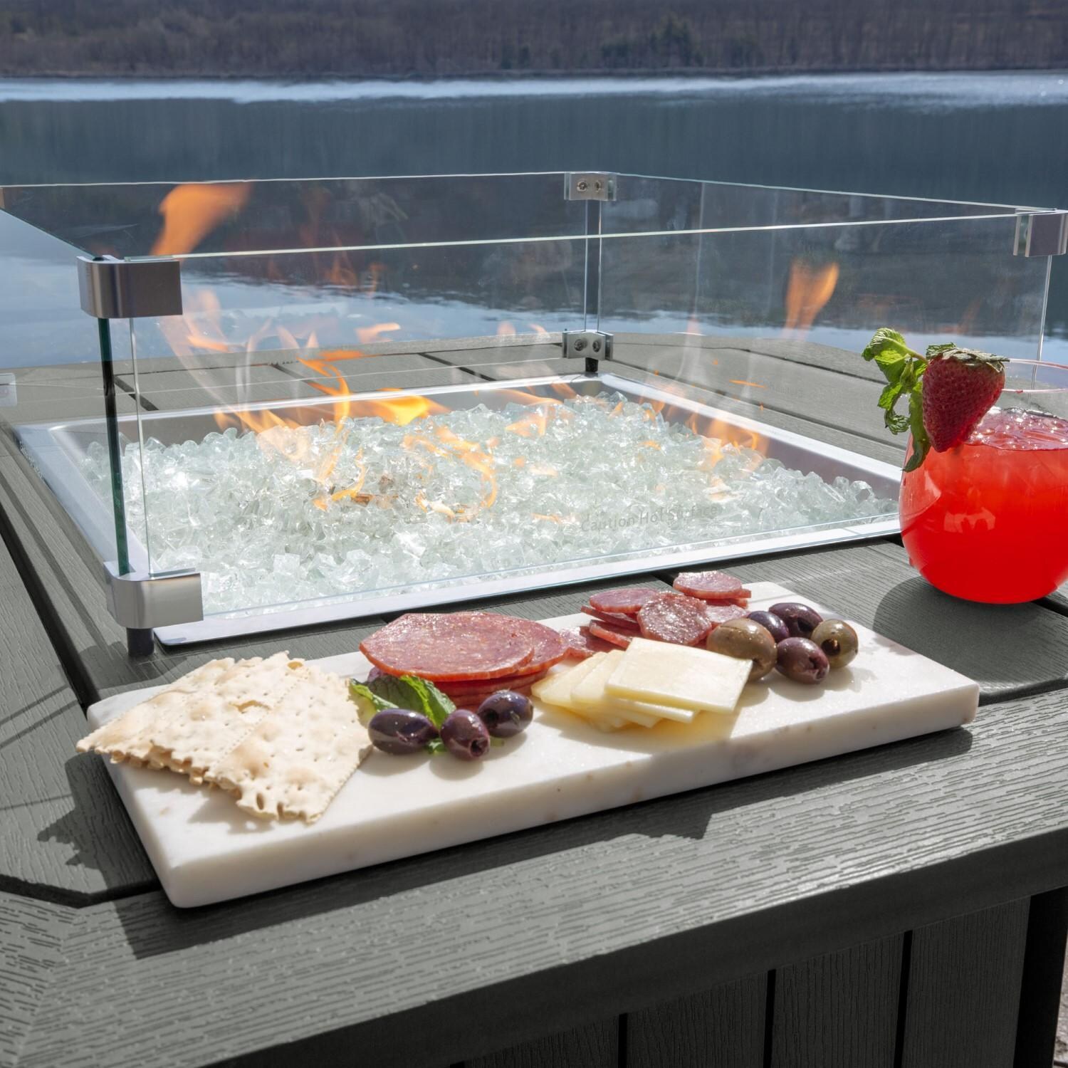 Harborview Octagonal Fire Pit Table in Coastal Teak by Lakeview Outdoor Designs - In Use - Charcuterie Board - Lifestyle thumbnail