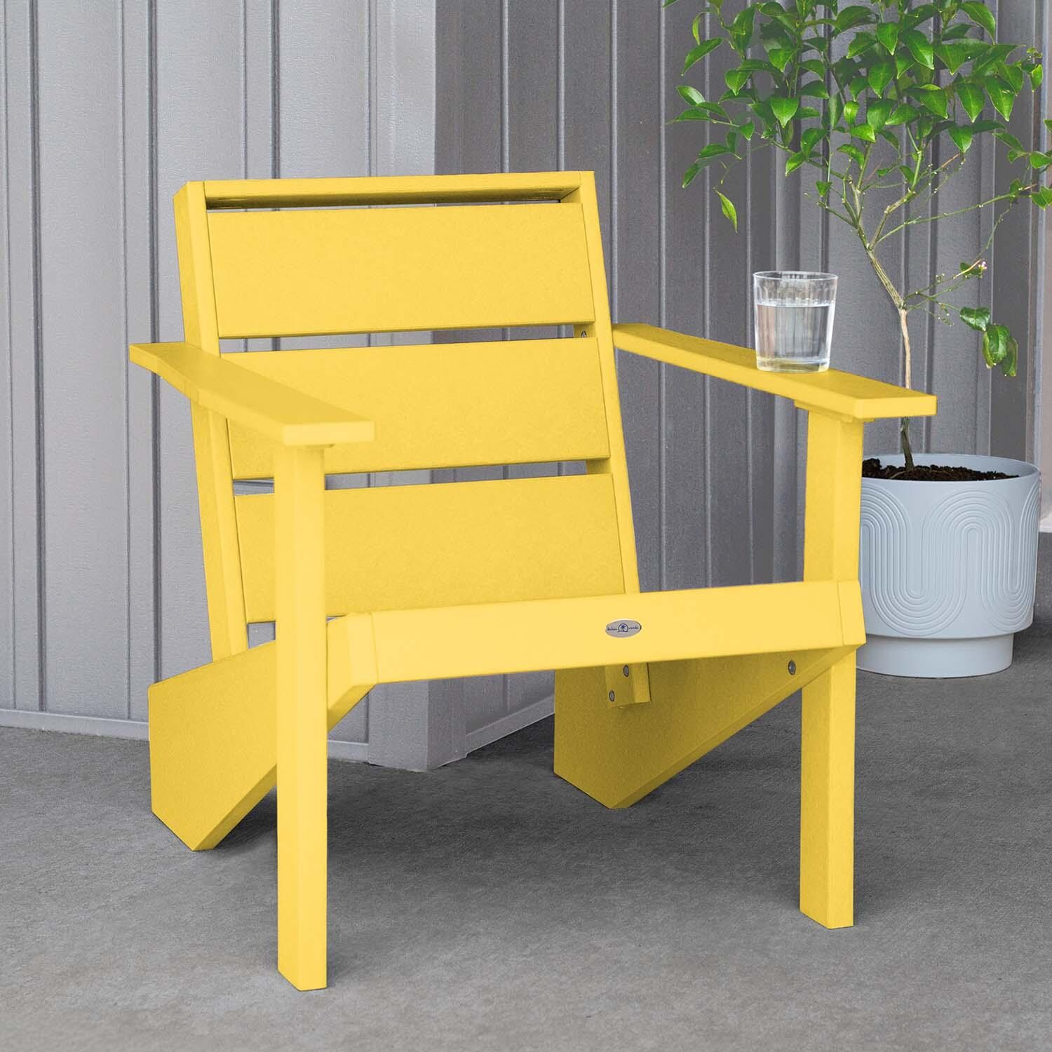 Hazel Cove Recycled Plastic Adirondack Chair in Sunbeam Yellow by Lakeview Outdoor Designs - Next to Flowerpot - Lifestyle thumbnail