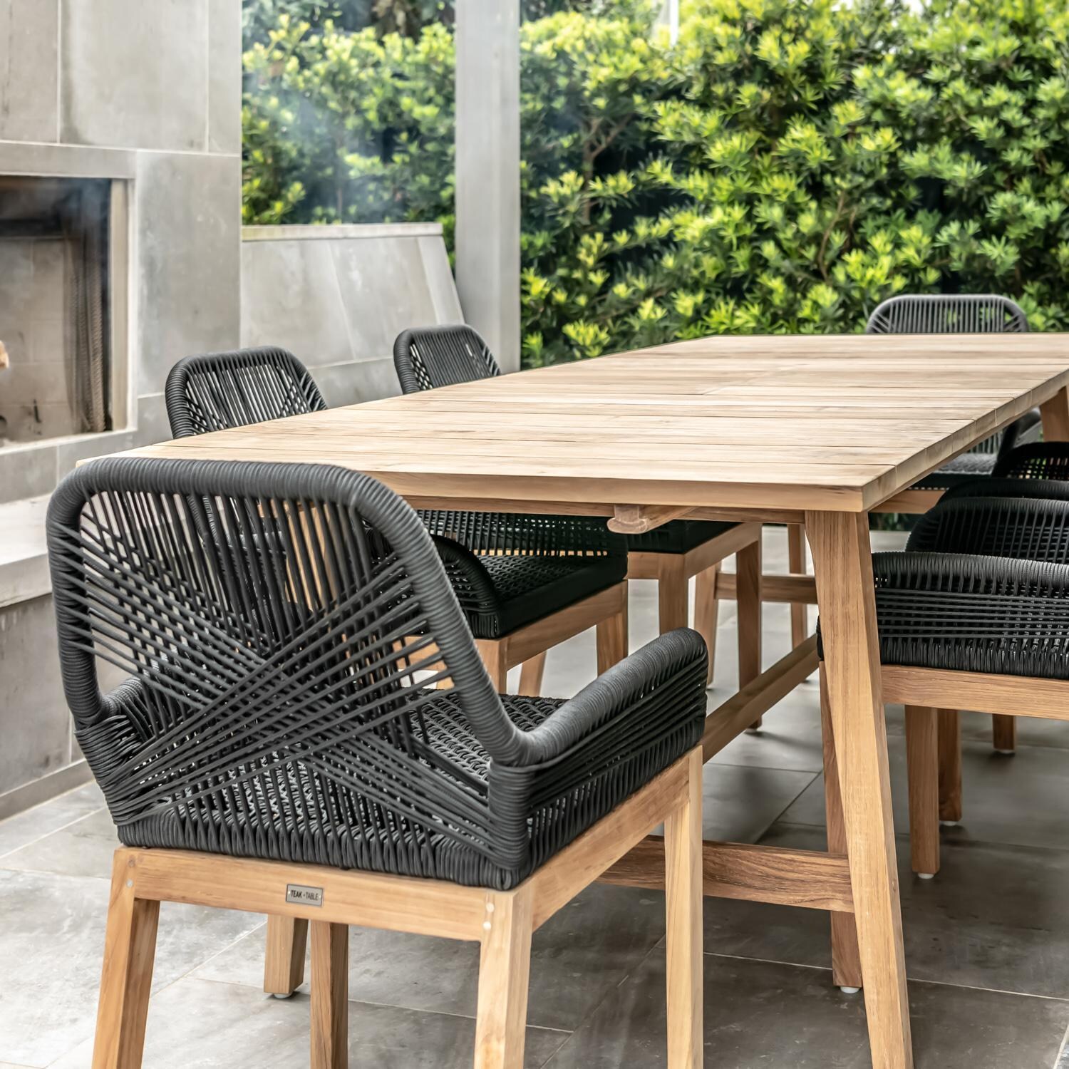 Teak + Table Breeze Olefin Rope & Teak Patio Dining Chair in Dune - Dune Lifestyle 1 - Lifestyle thumbnail