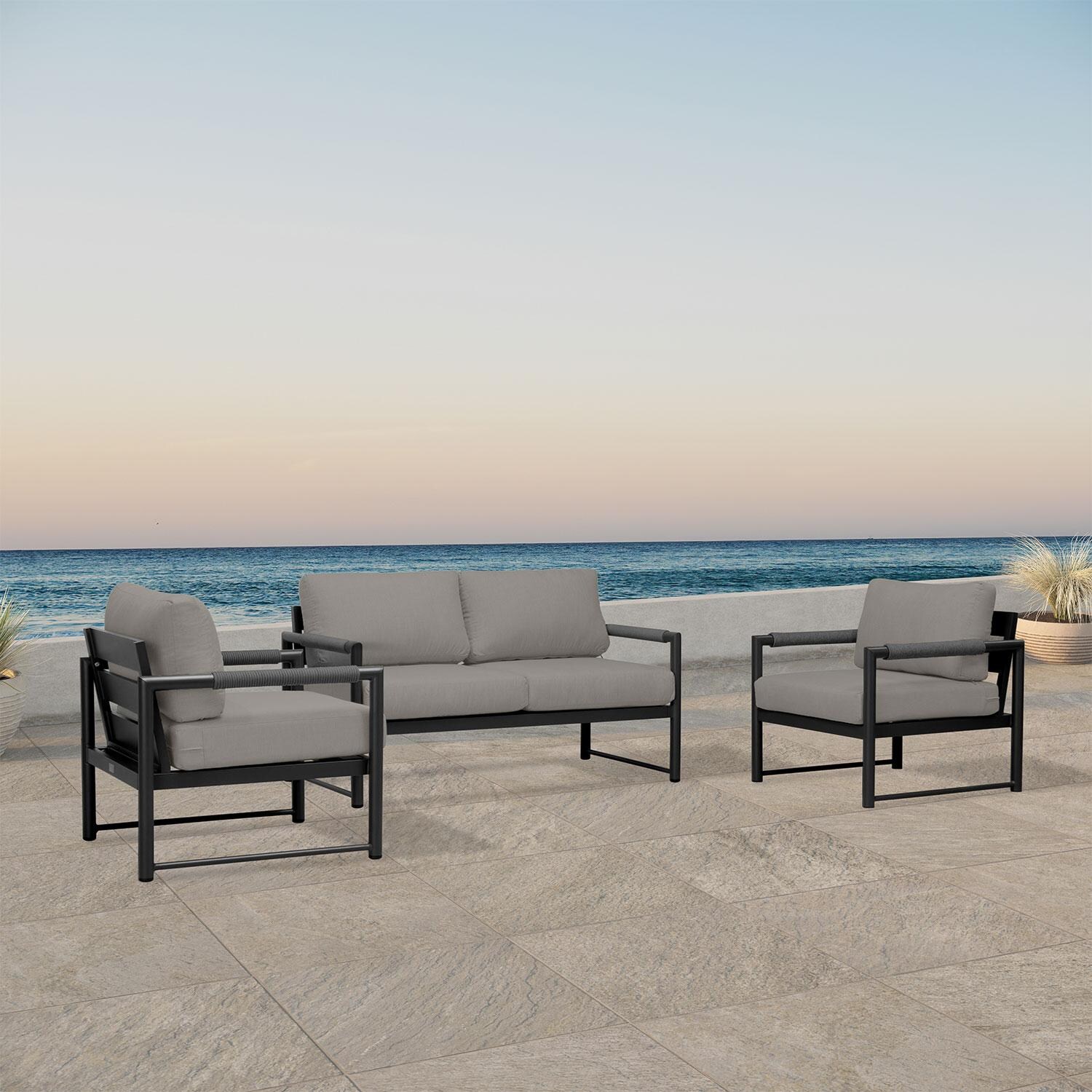 Lakeview AVEBAY-BK-CO-SET120-CC Avenue Bay Black/Carbon 3 Pc Loveseat Set - Canvas Charcoal - Angled On Patio - Lifestyle thumbnail