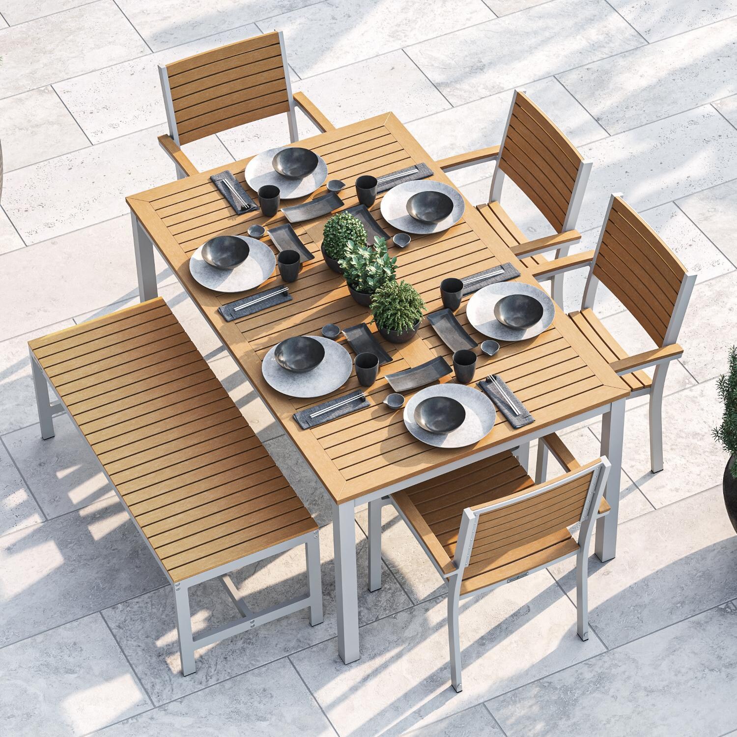 Oxford Garden Travira 6 Piece Flint Aluminum Patio Dining Set W/ Natural Tekwood Armchairs, 63-Inch Rectangular Natural Tekwood Table & Backless Bench thumbnail