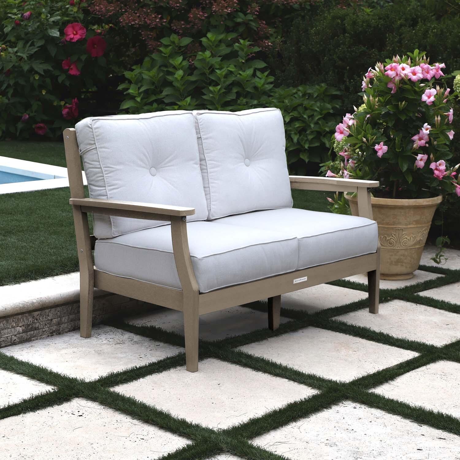 Blushing Bay 2 Person Recycled Plastic Loveseat in Bliss Linen/Woodland Brown by Lakeview Outdoor Designs - Left Angled - Lifestyle thumbnail