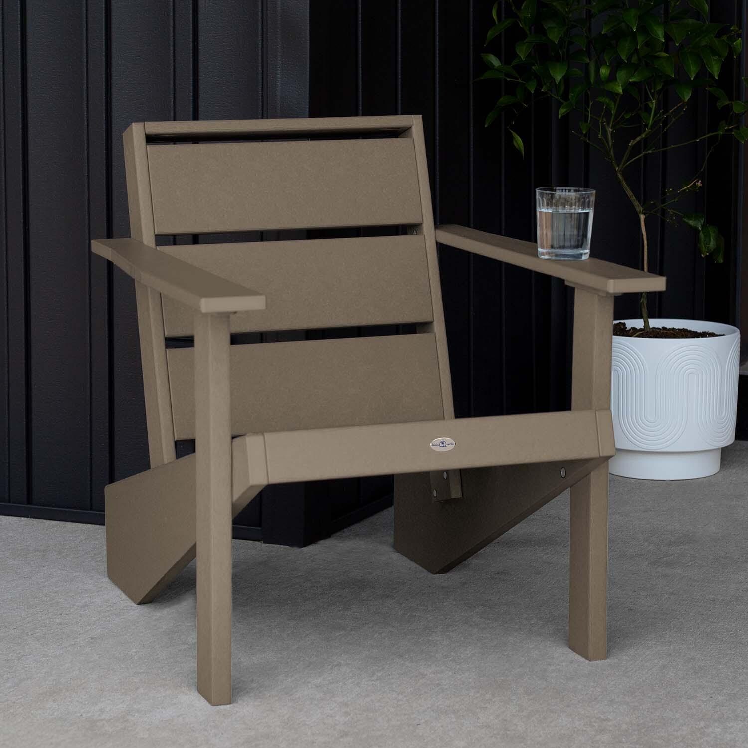 Hazel Cove Recycled Plastic Adirondack Chair in Cabana Tan by Lakeview Outdoor Designs - Next to Flowerpot - Lifestyle thumbnail