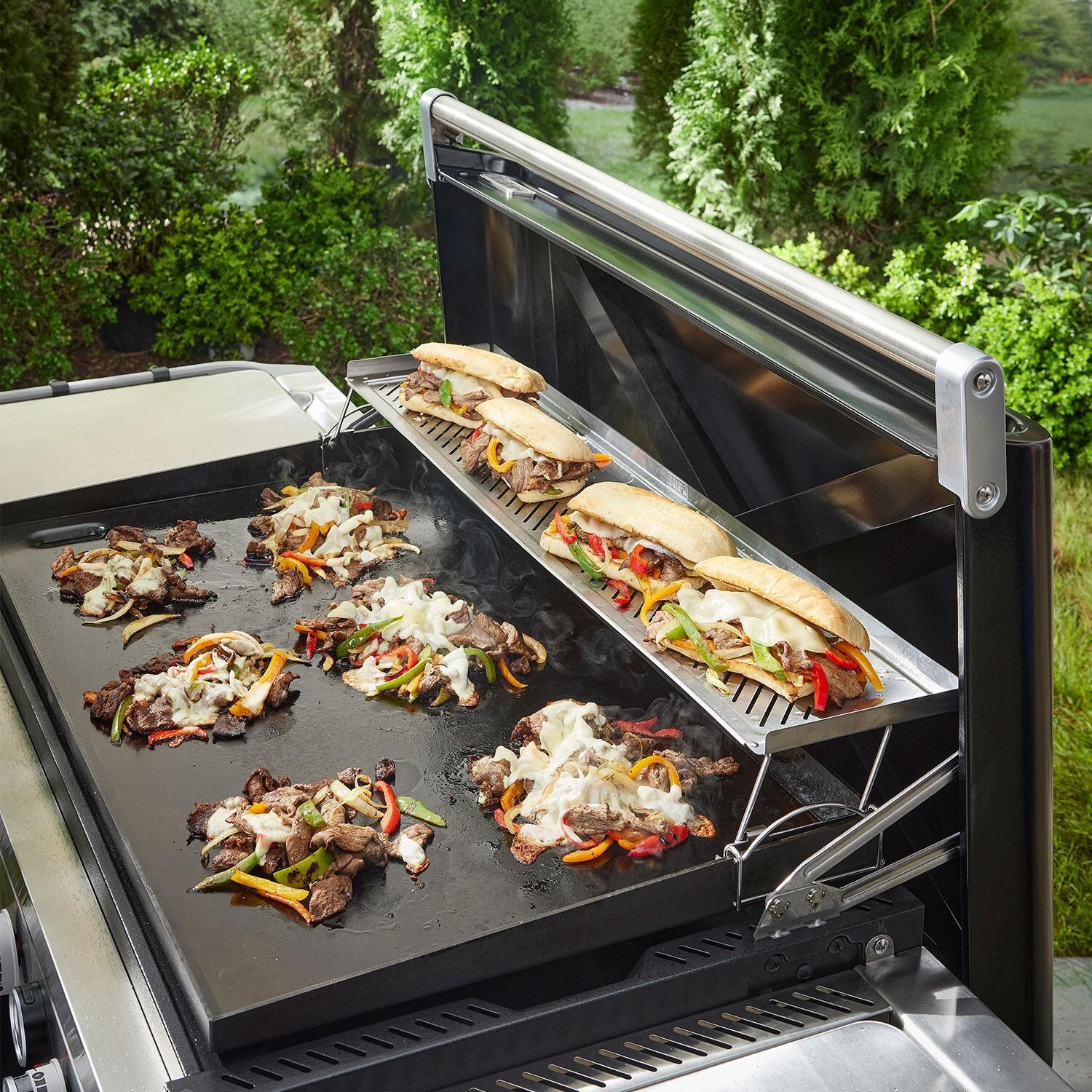 Weber 3400165 Dual-Level Warming Rack/Resting Tray for 36 Inch Slate Griddle - Rack Raised - On Grill W/ Philly Cheesestakes - Lifestyle thumbnail