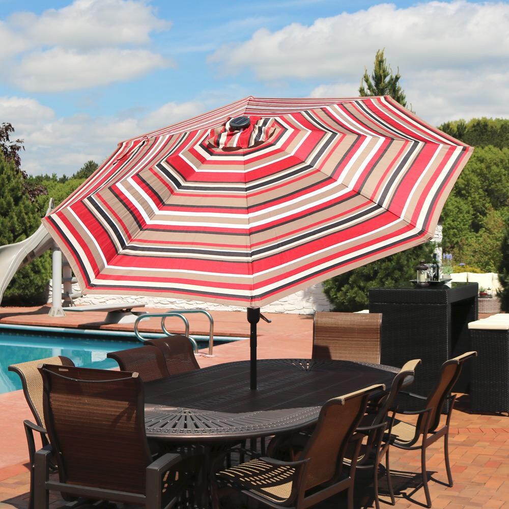 Ultimate Patio 9 Ft. Solar Lighted Octagonal Patio Umbrella W/ Crank Lift - Awning Stripe Canopy - Lifestyle View thumbnail