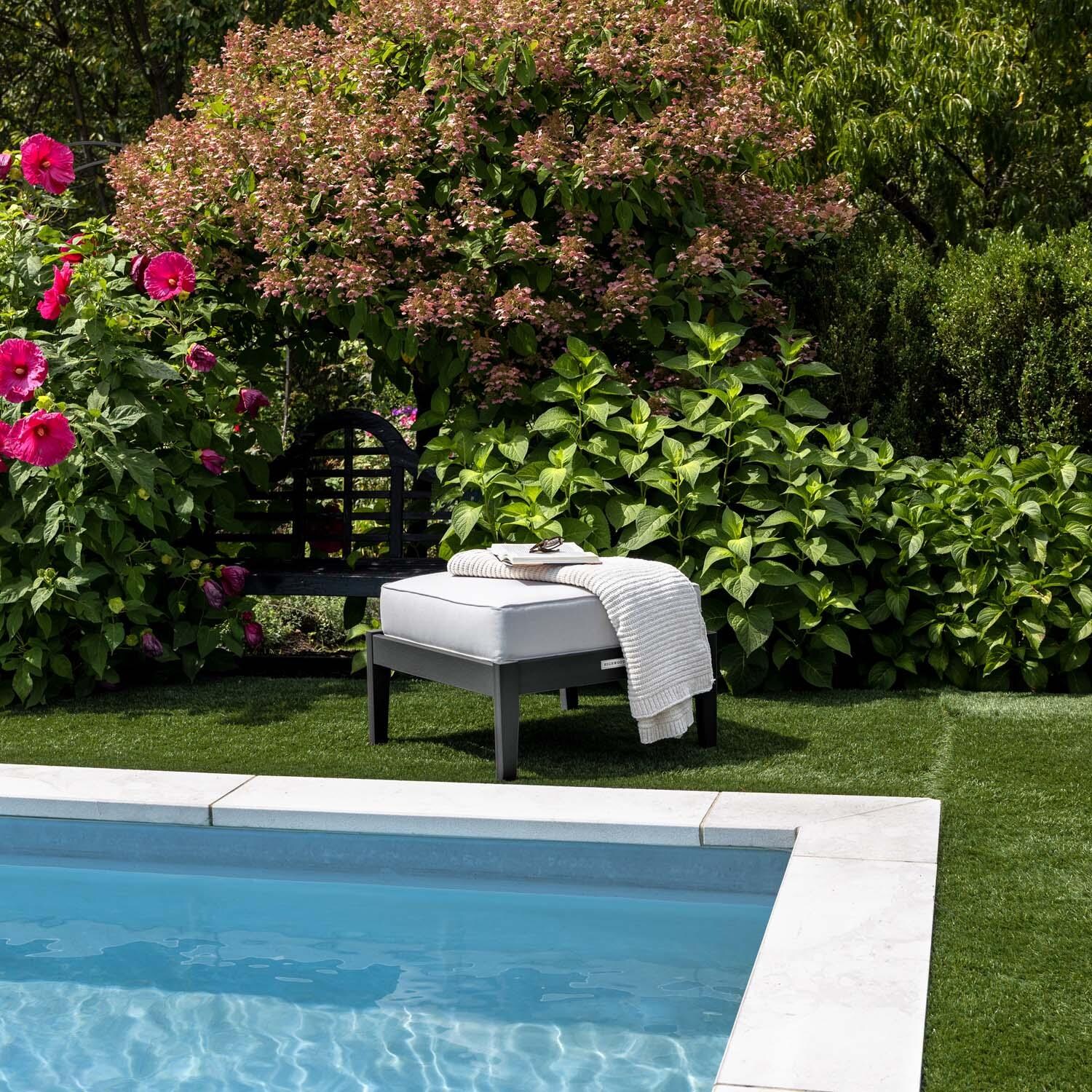 Blushing Bay Recycled Plastic Ottoman in Bliss Linen/Black by Lakeview Outdoor Designs - By Pool - Lifestyle thumbnail
