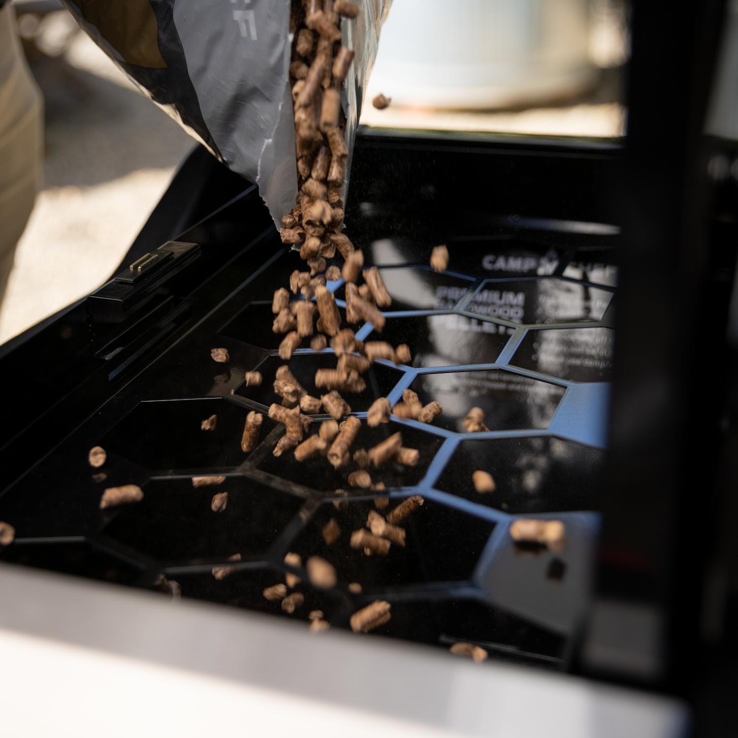 Camp Chef PG24HGSK Apex 24-Inch Pellet Grill W/ Gas Kit and Sidekick - Filling Up The Hopper thumbnail