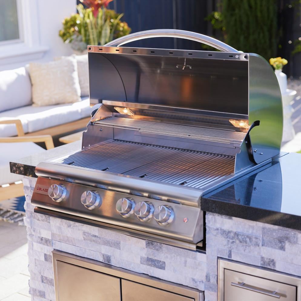 BBQGuys Signature 6 Ft Grill Island w/ 32-in Natural Gas Blaze LTE+ Grill, Refrigerator & Door & Drawer | Alaska Gray w/ Black Granite - Open Grill - Lifestyle thumbnail