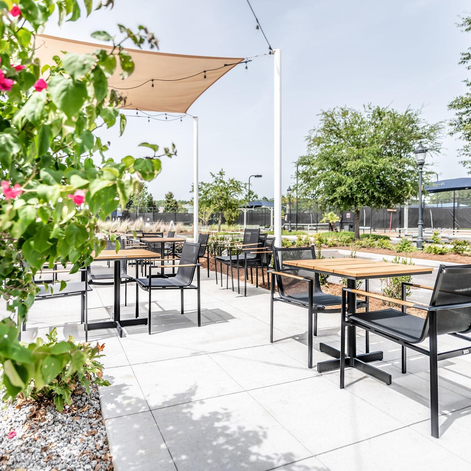 Teak + Table St Barts Aluminum Stacking Dining Chair in Black - Outdoor Seating - Lifestyle thumbnail