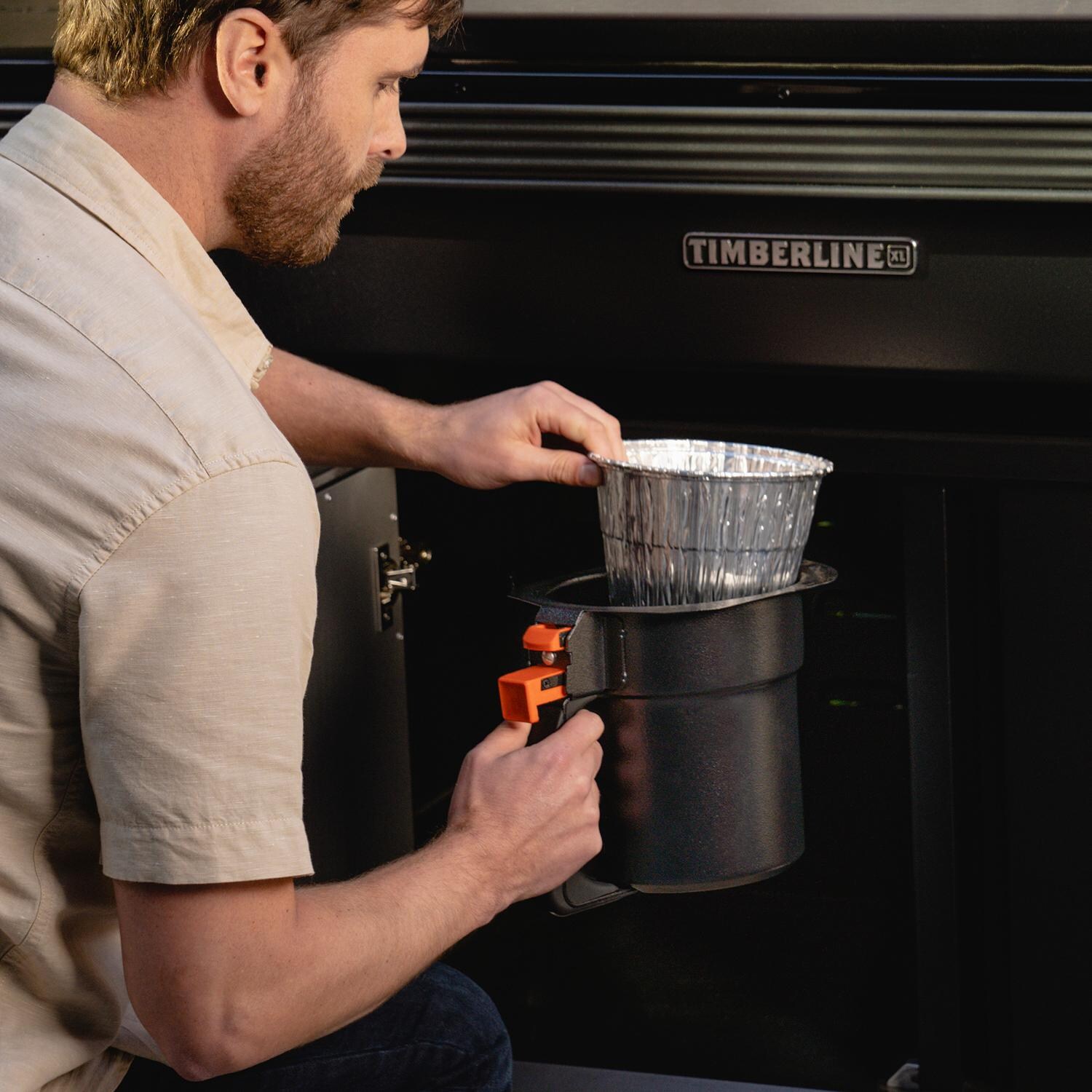 Traeger BAC608 Grease & Ash Keg Liner 5 Pack - Placing Liner in Timberline Grease & Ash Keg thumbnail