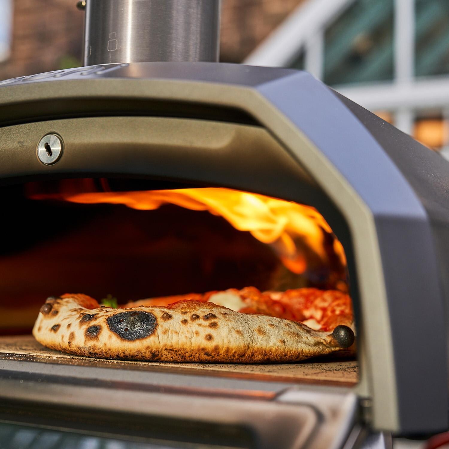 Ooni UU-P25100 Karu 12G Multi-Fuel Portable Pizza Oven - In Use - Lifestyle thumbnail