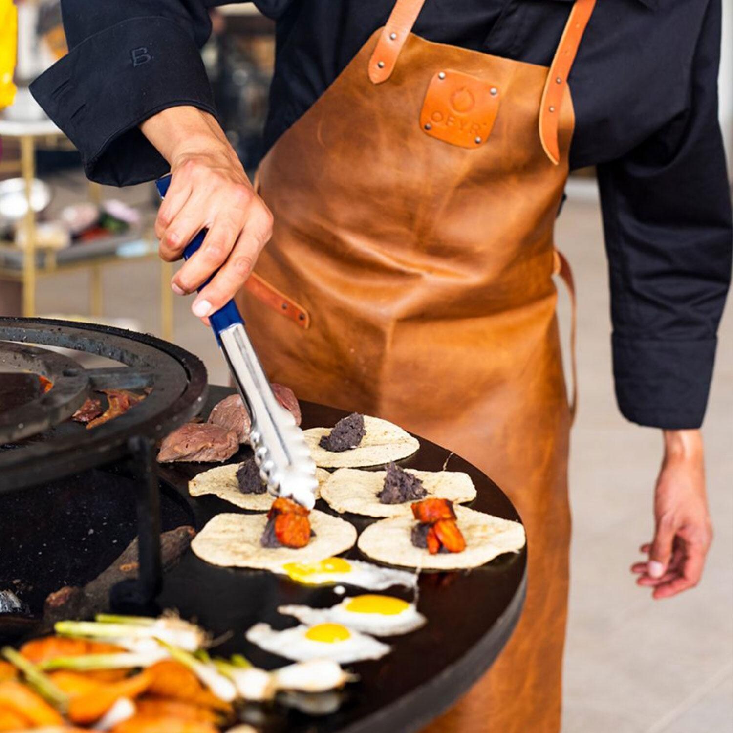 OFYR OI-100-TW Island Corten 100 Teak Wood 40 Inch Wood-Fired Flat Top Grill - In Use - Lifestyle thumbnail