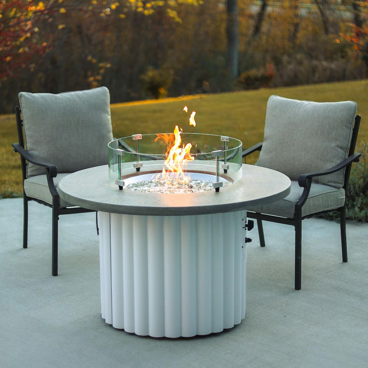 Reverie REVRWH-42-K-NG 42-in Round Aluminum Natural Gas Aluminum Fire Pit Table w/ Relic Grey Supercast Top & White Base (Ships Propane w/ Conversion Kit) - Wind Guard On - Lifestyle thumbnail