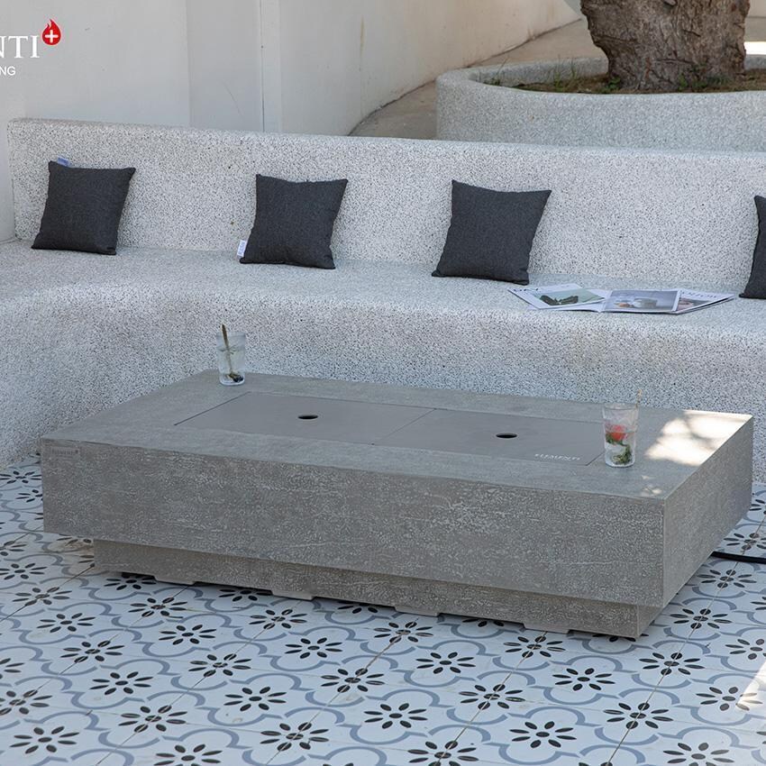 Riviera OFG415LG-LP 60 Inch Rectangular Concrete Propane Fire Pit Table in Gray By Elementi - Back Patio - Covered - Lifestyle thumbnail