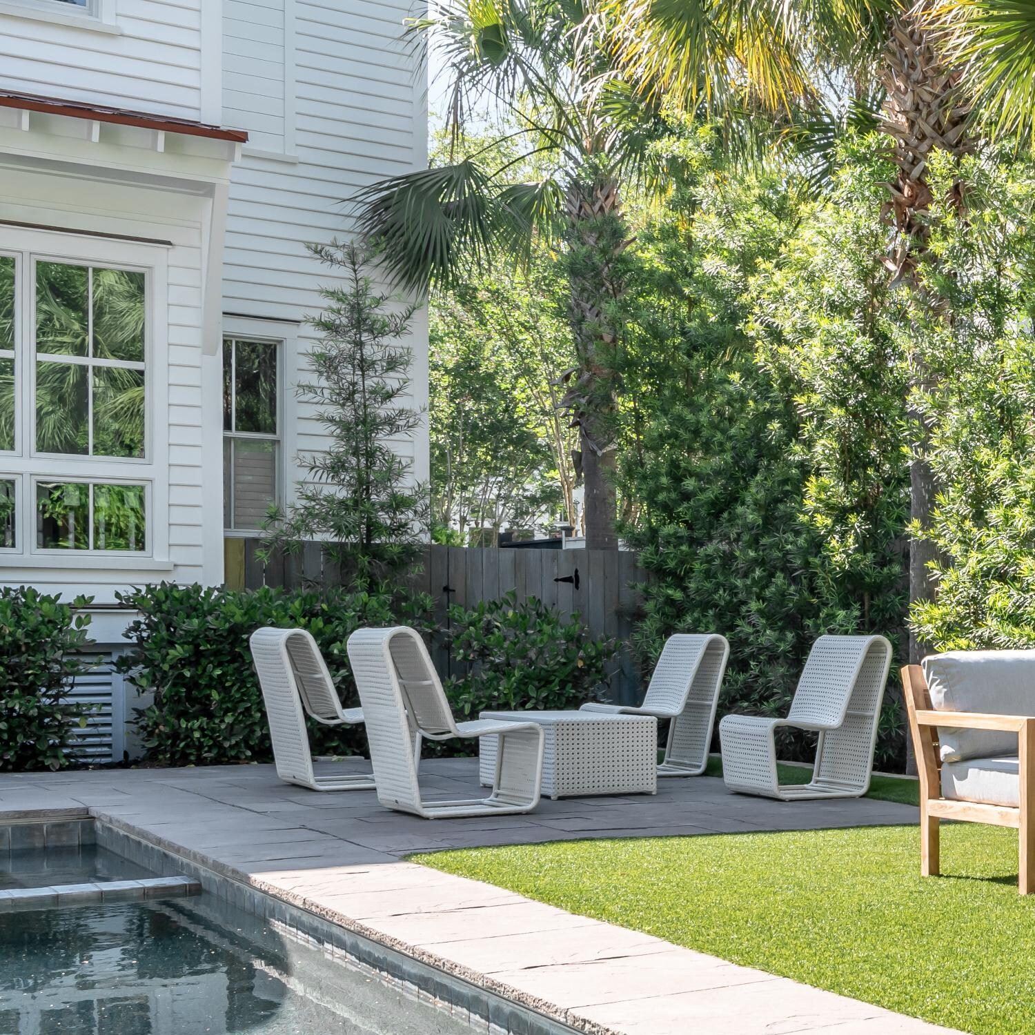 Teak + Table Breeze Wicker Patio Armless Club Chair in Off-White Cane - Garden Seating - Lifestyle thumbnail