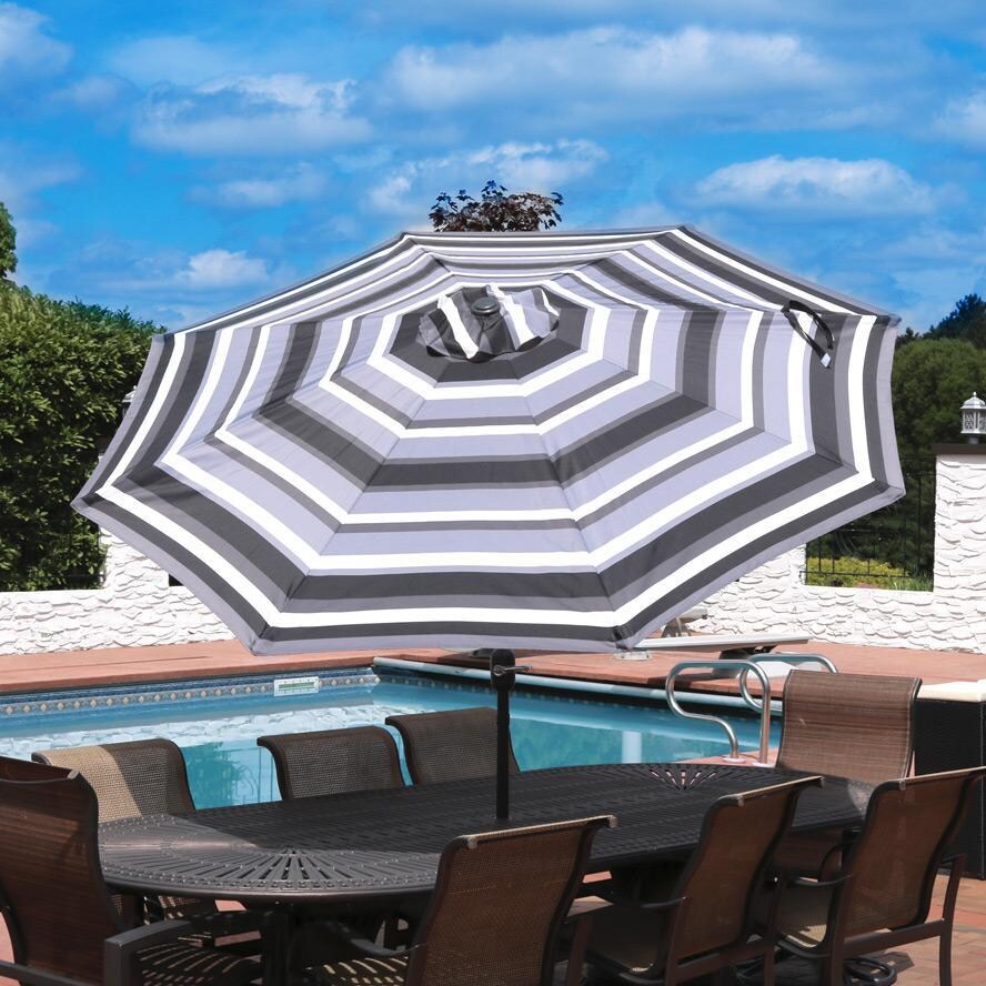 Ultimate Patio 9 Ft. Octagonal Patio Umbrella W/ Crank & Tilt - Catalina Beach Stripe - Lifestyle View thumbnail
