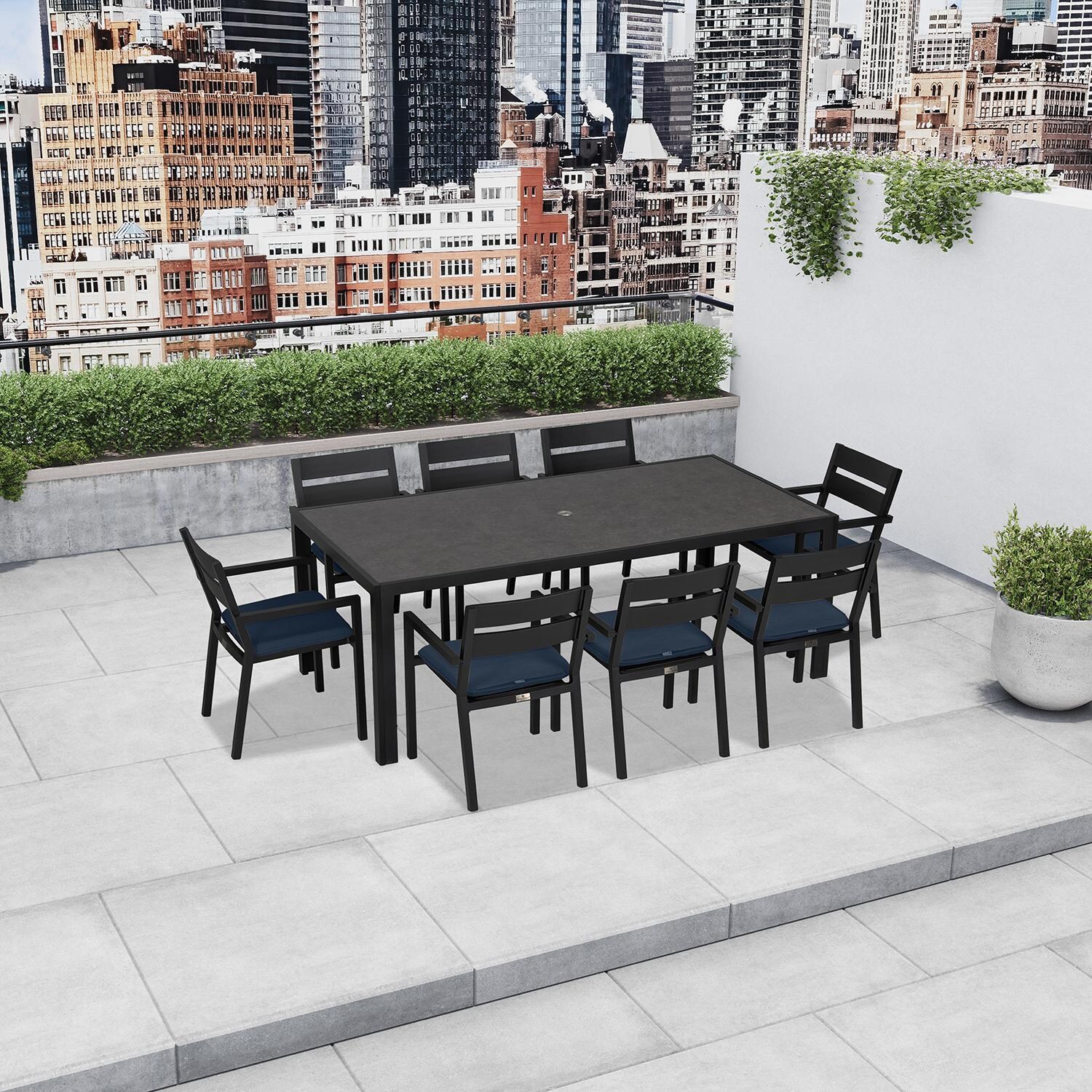 Calm Bay 9 Pc Rectangular Dining Set in White/Spectrum Indigo by Lakeview - On the Patio (Shown in Black/Spectrum Indigo) - Lifestyle thumbnail