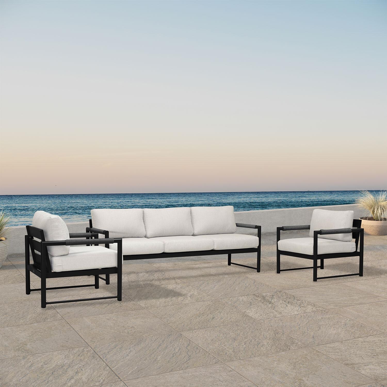 Lakeview AVEBAY-BK-CO-SET141-CS Avenue Bay Black/Carbon 3 Pc Sofa Club Chair Set - Cast Silver - Angled On Patio - Lifestyle thumbnail