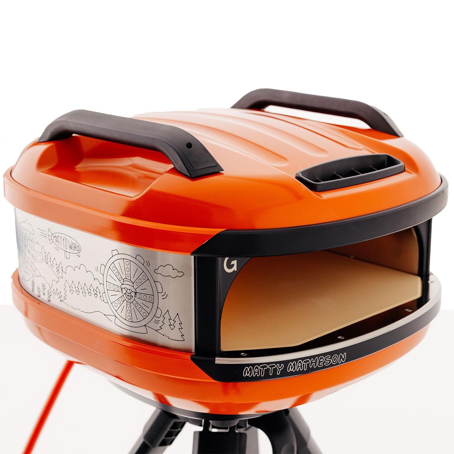 Matty Matheson x Gozney GTPOGUS1225 Limited-Edition Tread Portable Propane Pizza Oven - Orange - On Tread Stand - Top View - White Background thumbnail