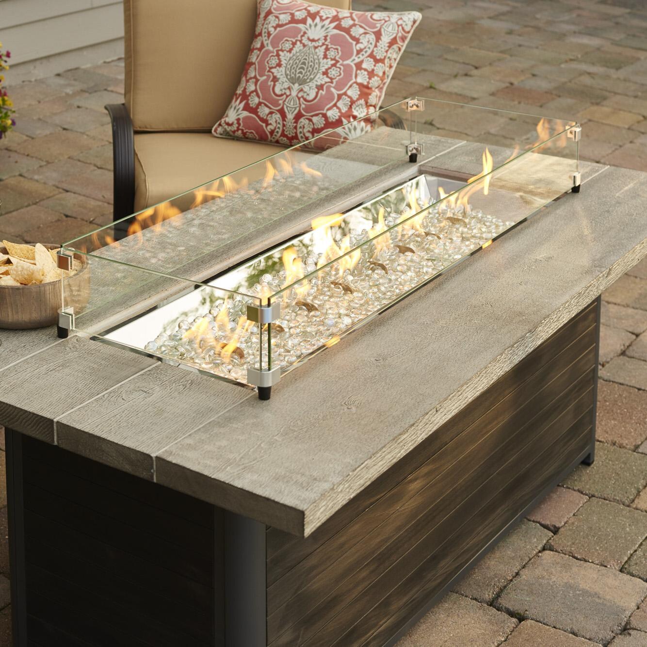 Lakeview Outdoor Designs Cedar Ridge Linear Gas Fire Pit Table - Lifestyle - Close-up - Glass wind guard pictured is optional accessory thumbnail