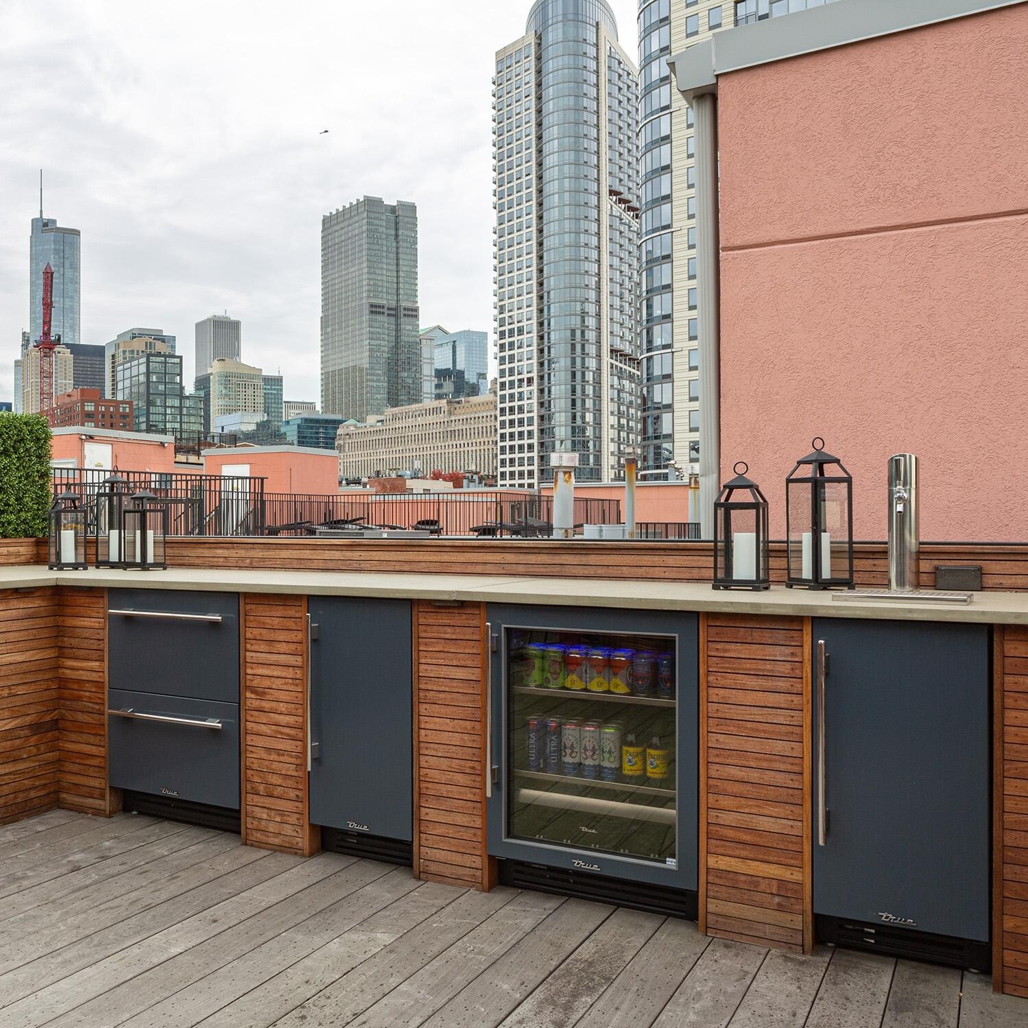 True TUF-24D-OP-C~DSK-030-H01 24 Inch 5.6 Cu. Ft. Outdoor Freezer Drawer in Matte White w/ Brass Handles (Shown in Cobalt) - Skyline - Lifestyle thumbnail