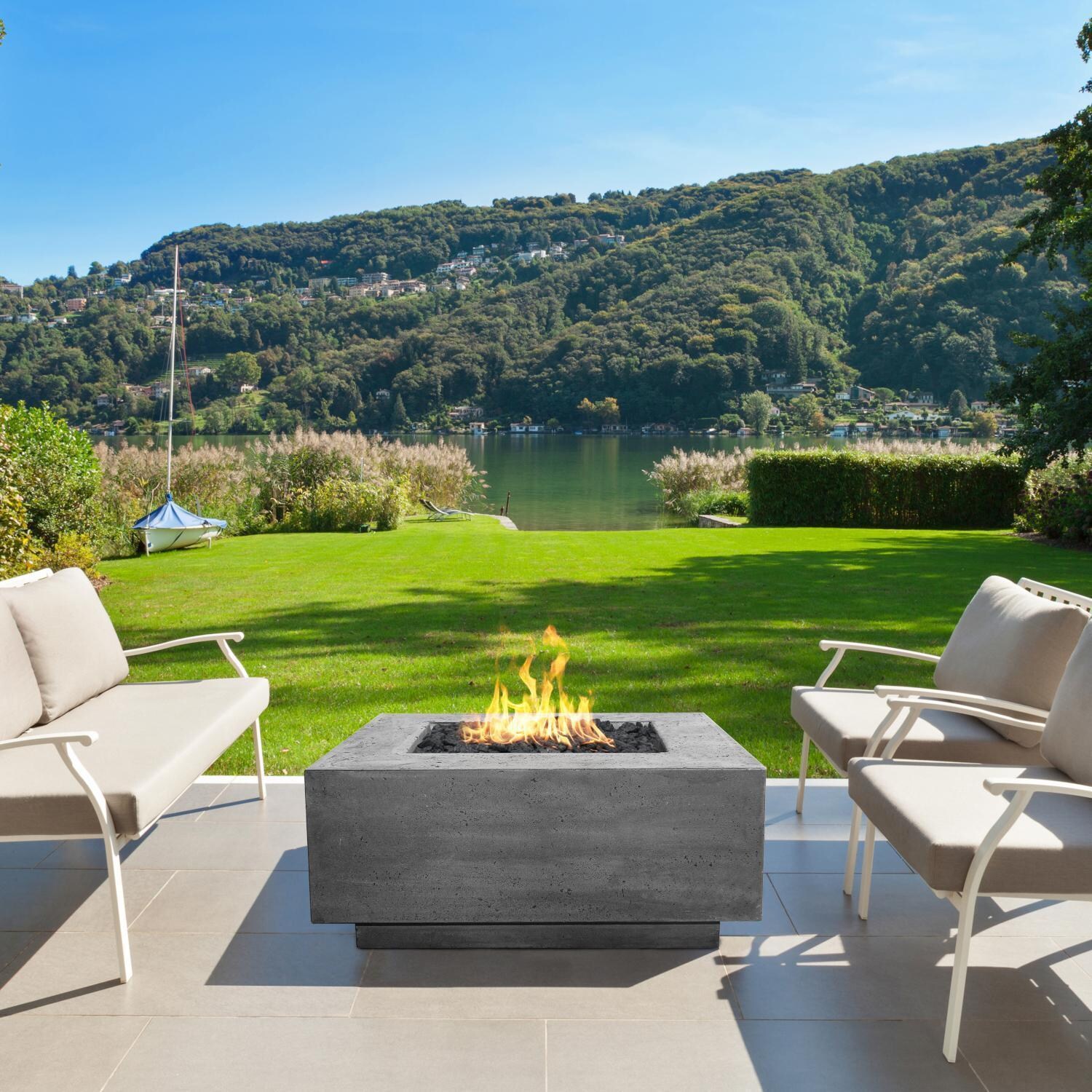Tavola 42 Inch Square Glass Fiber Reinforced Concrete Natural Gas Fire Pit Table in Coastal by Prism Hardscapes - On the Patio (Shown in Pewter) - Lifestyle thumbnail