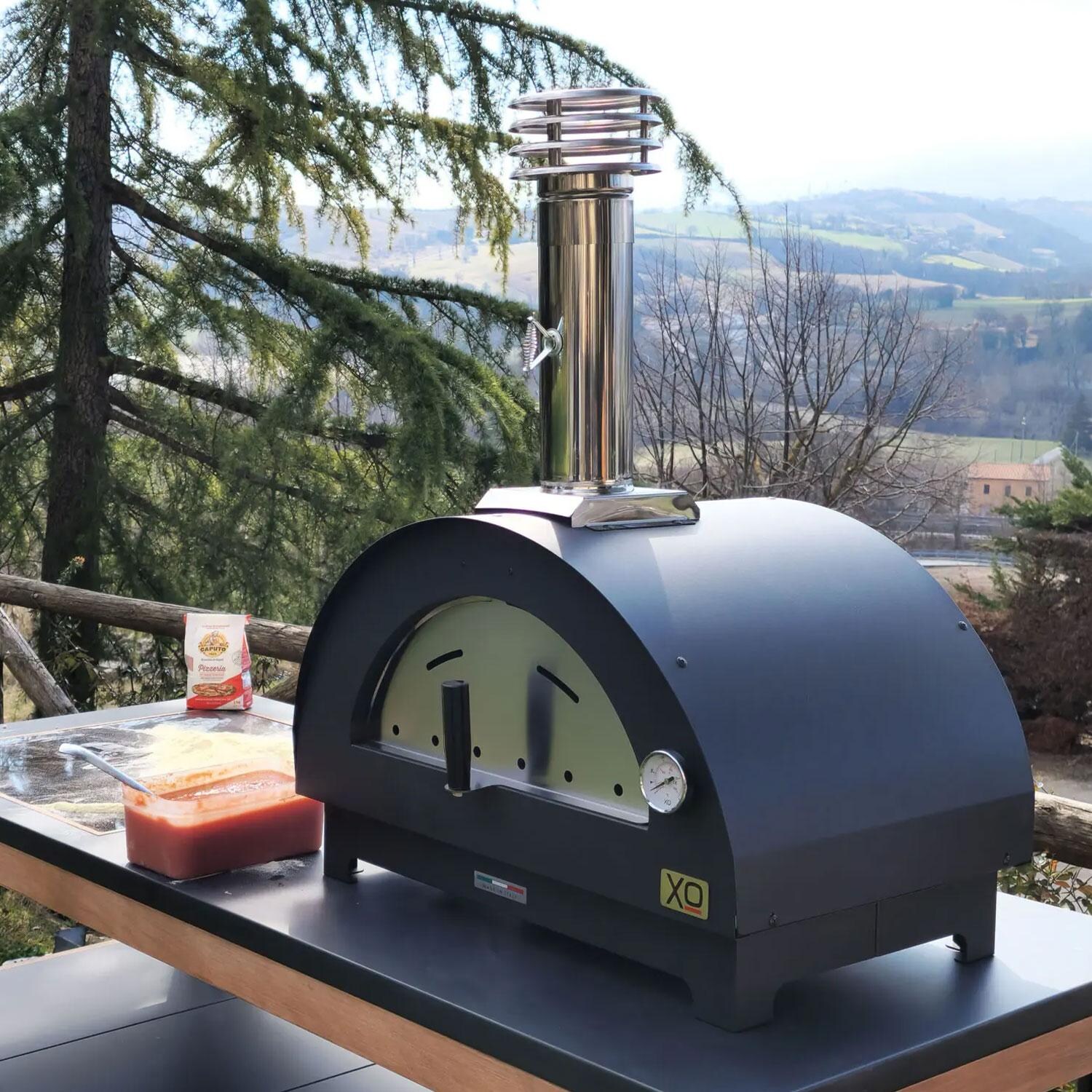 XO Appliance XOPIZZA1CA PIZZA1 Countertop Wood-Fired Pizza Oven in Carbona - On Countertop - Side View - Lifestyle thumbnail