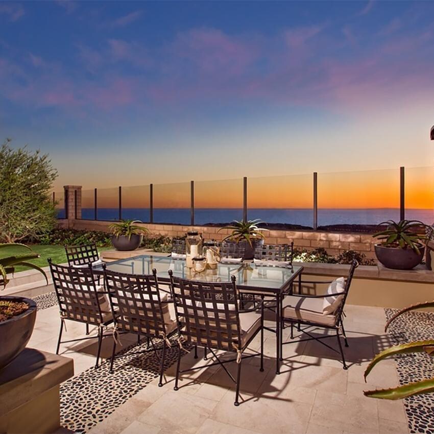 Provence 7 Pc Wrought Iron Dining Set W/Sunbrella Canvas Flax Cushions in Century Pewter By Sunset West - Rooftop Dinner - Lifestyle thumbnail