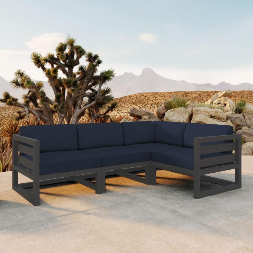 Misty Cove 4 Piece Sectional Set in Slate w/Spectrum Indigo Cushions by Lakeview - On Patio - Lifestyle thumbnail