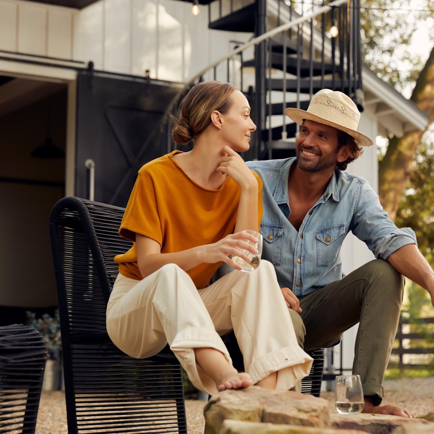 Teak + Table Breeze Olefin Rope Patio Armless Club Chair in Charcoal - Seat Sharing - Lifestyle thumbnail