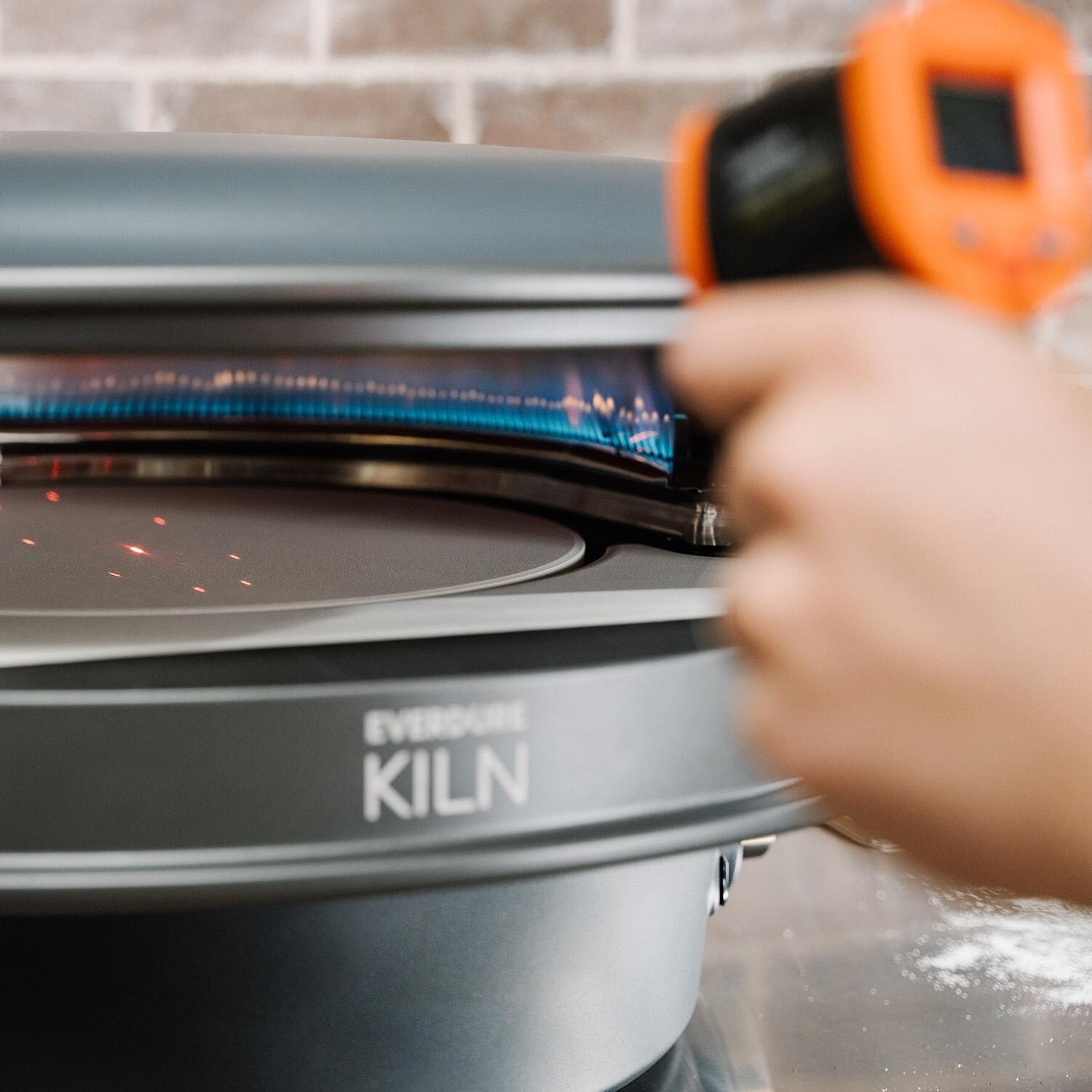 Everdure EKILN2GUS 2-Burner KILN Pizza Oven - Graphite - Checking Temperature - Lifestyle thumbnail