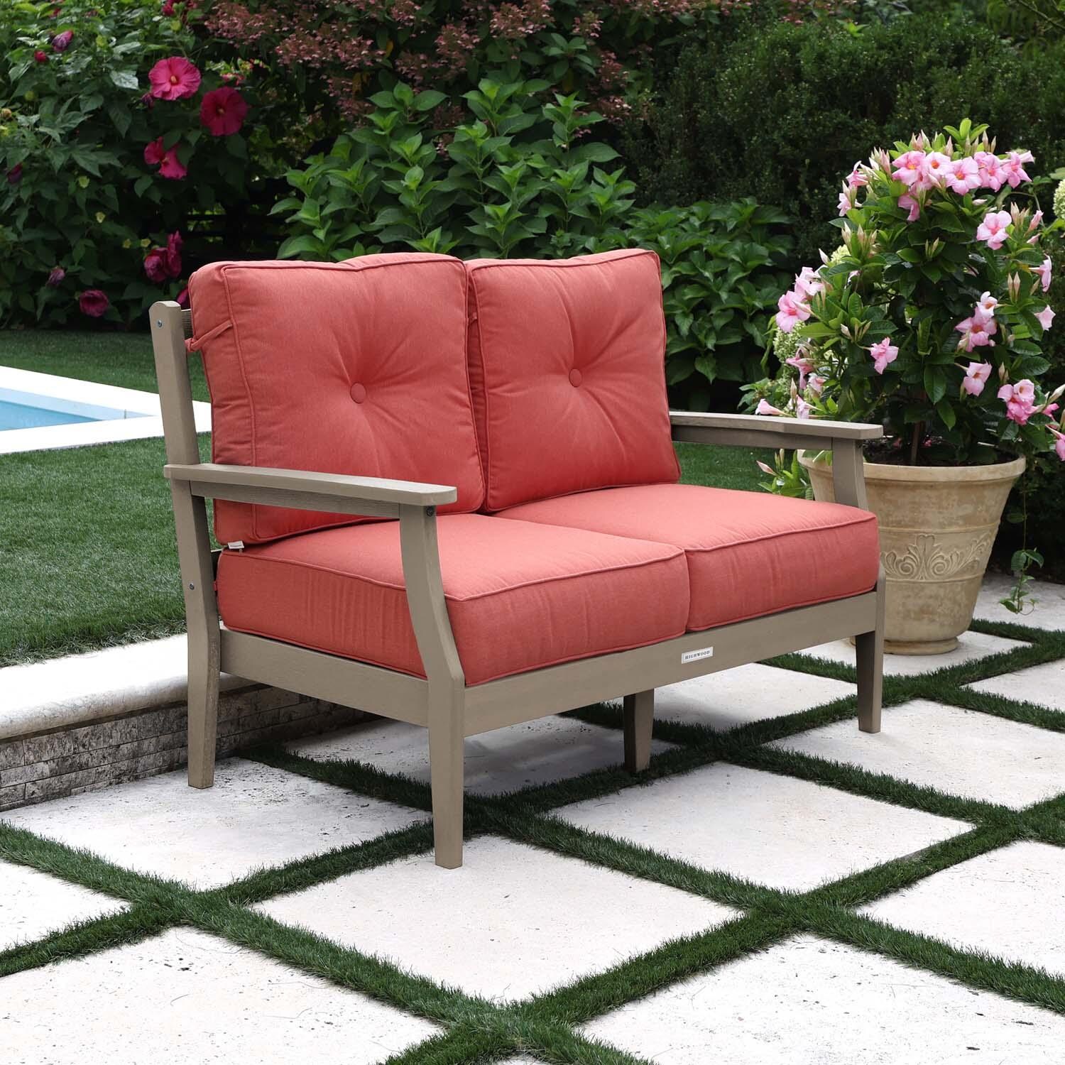 Blushing Bay 2 Person Recycled Plastic Loveseat in Canvas Persimmon/Woodland Brown by Lakeview Outdoor Designs - Left Angled - Lifestyle thumbnail