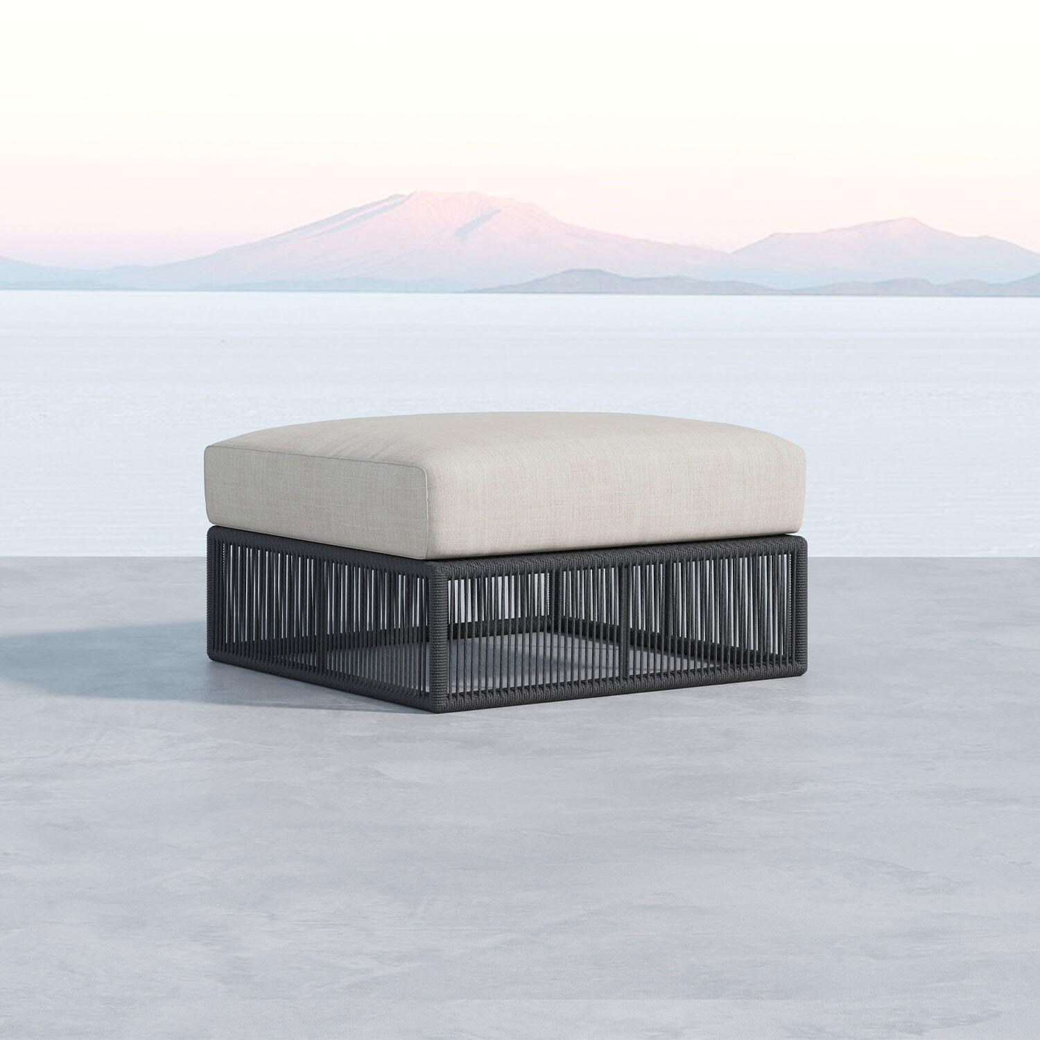 Milano Aluminum & Olefin Rope Patio Ottoman in Dupione Celeste w/ Self Welt By Sunset West - Oceanside View - Shown in Echo Ash finish - Lifestyle thumbnail