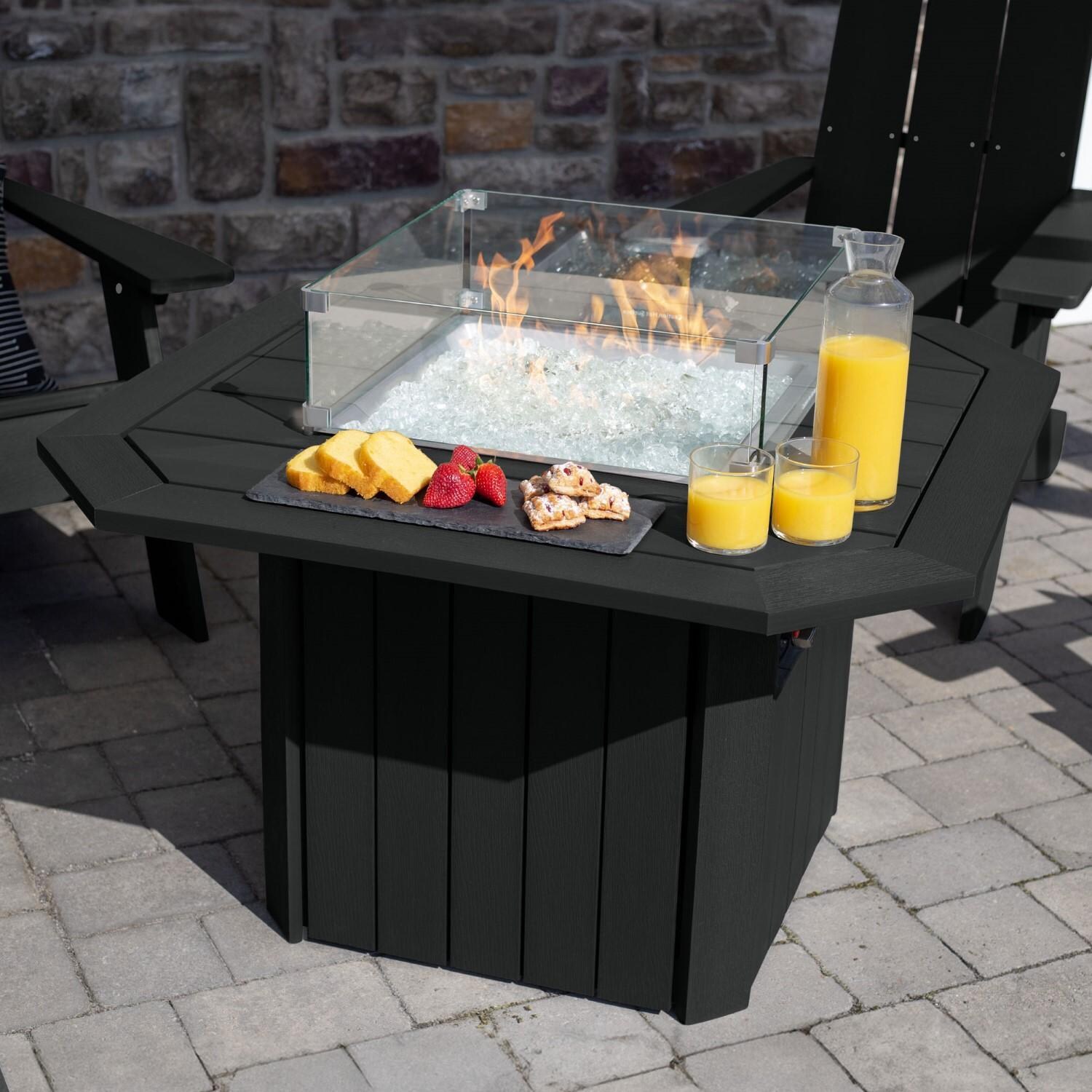 Harborview 5 Pc Adirondack Set W/ Fire Pit Table in Black by Lakeview Outdoor Designs - Angled Table View - Lifestyle thumbnail