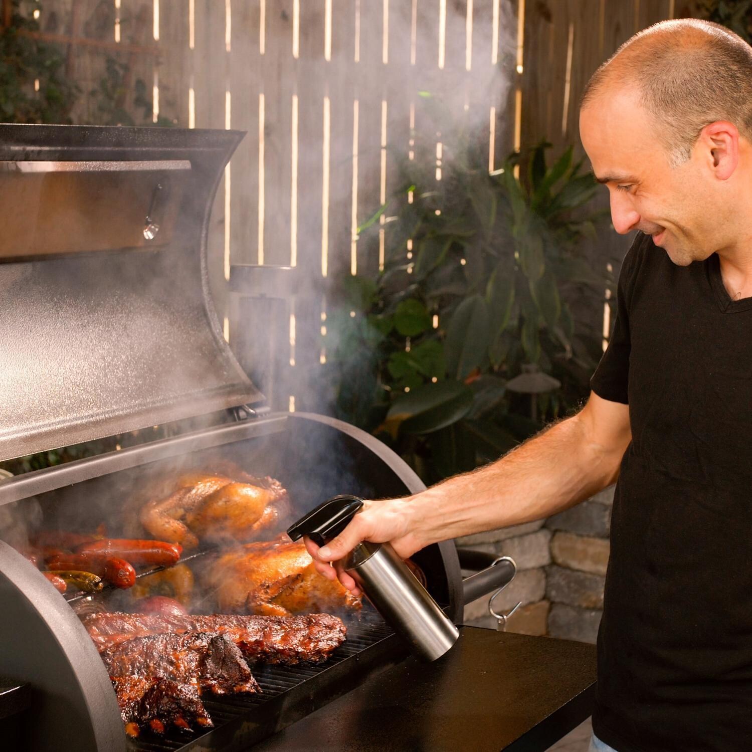 Victory BBQ-PG + BBQ-PG-CVR + BBQ-PLT20-HK + BBQ-PLT20-MQ + BBQ-PLT20-AP 35-Inch Wood Pellet Grill, Cover, & 20 Lb. Hardwood Pellets Ultimate Starter Pack - Spritzing Some Ribs - Lifestyle thumbnail