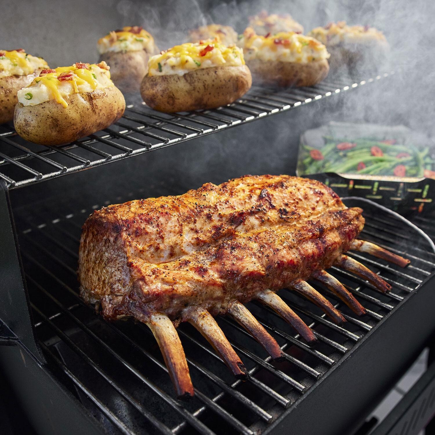 Weber 1500120 Searwood 600 Porcelain Coated Steel Pellet Grill - Bone-in Pork Roast on Grill - Lifestyle thumbnail