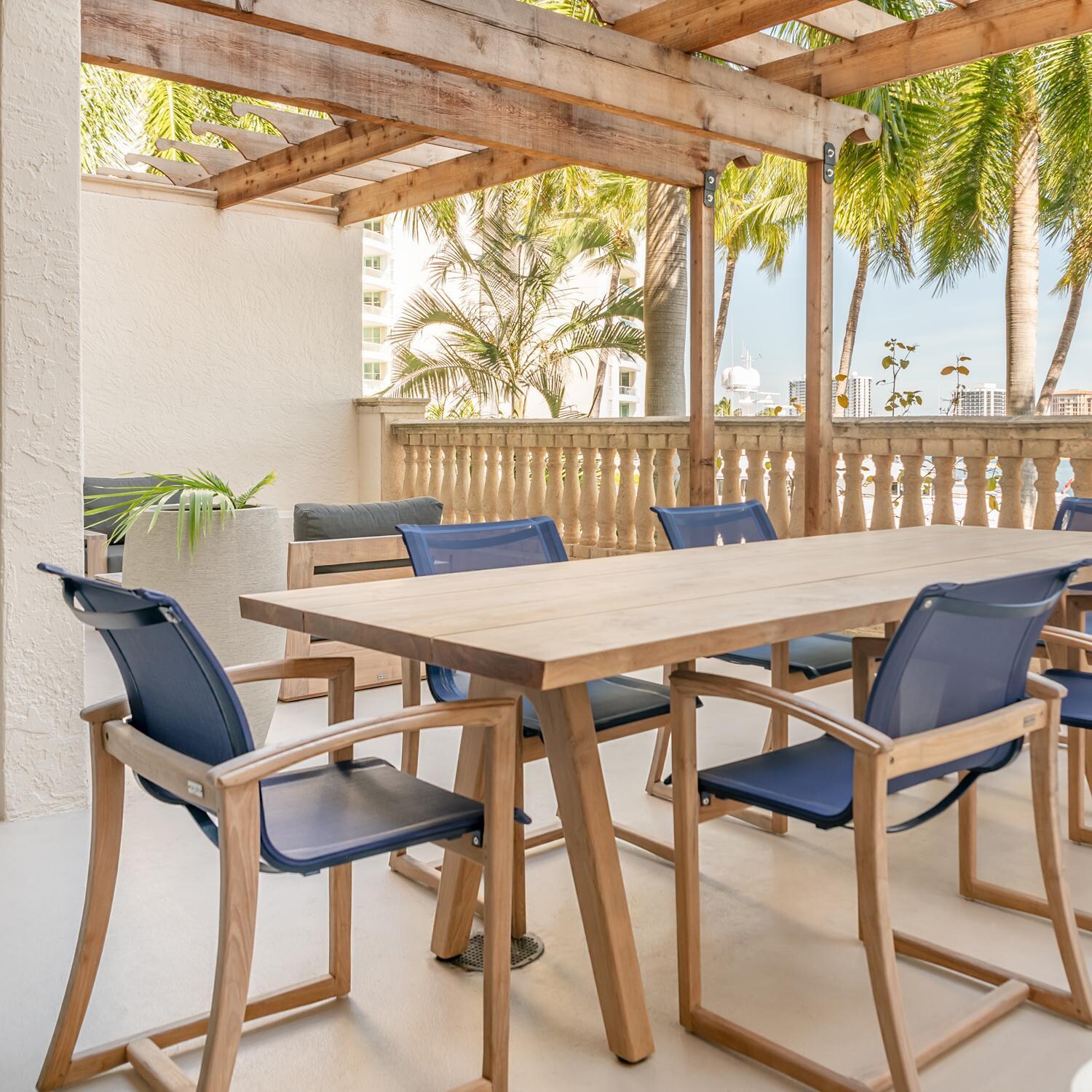 Teak + Table Capri Sling Dining Chair in Navy - Lifestyle thumbnail