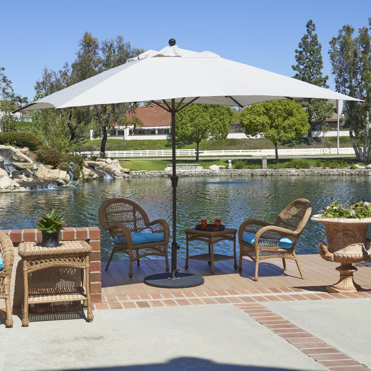 California Umbrella 11 X 8 Ft Rectangular Aluminum Patio Umbrella W/ Crank Lift & Aluminum Ribs - Lifestyle (Shown in Sunbrella Canvas Natural / Base Not Included) thumbnail