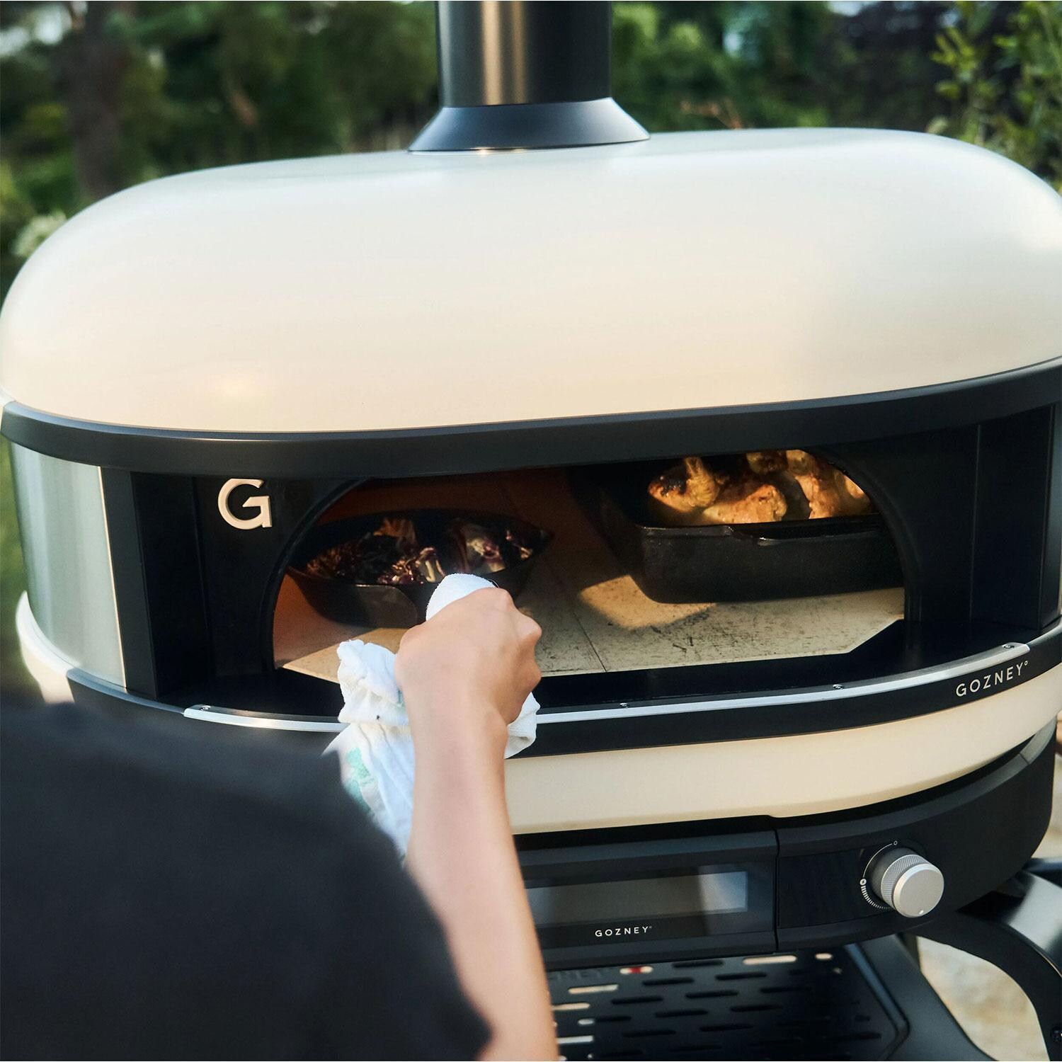 Gozney GMPBNUS1625 Dome Gen 2 Propane Pizza Oven - Bone - In Use - Lifestyle thumbnail