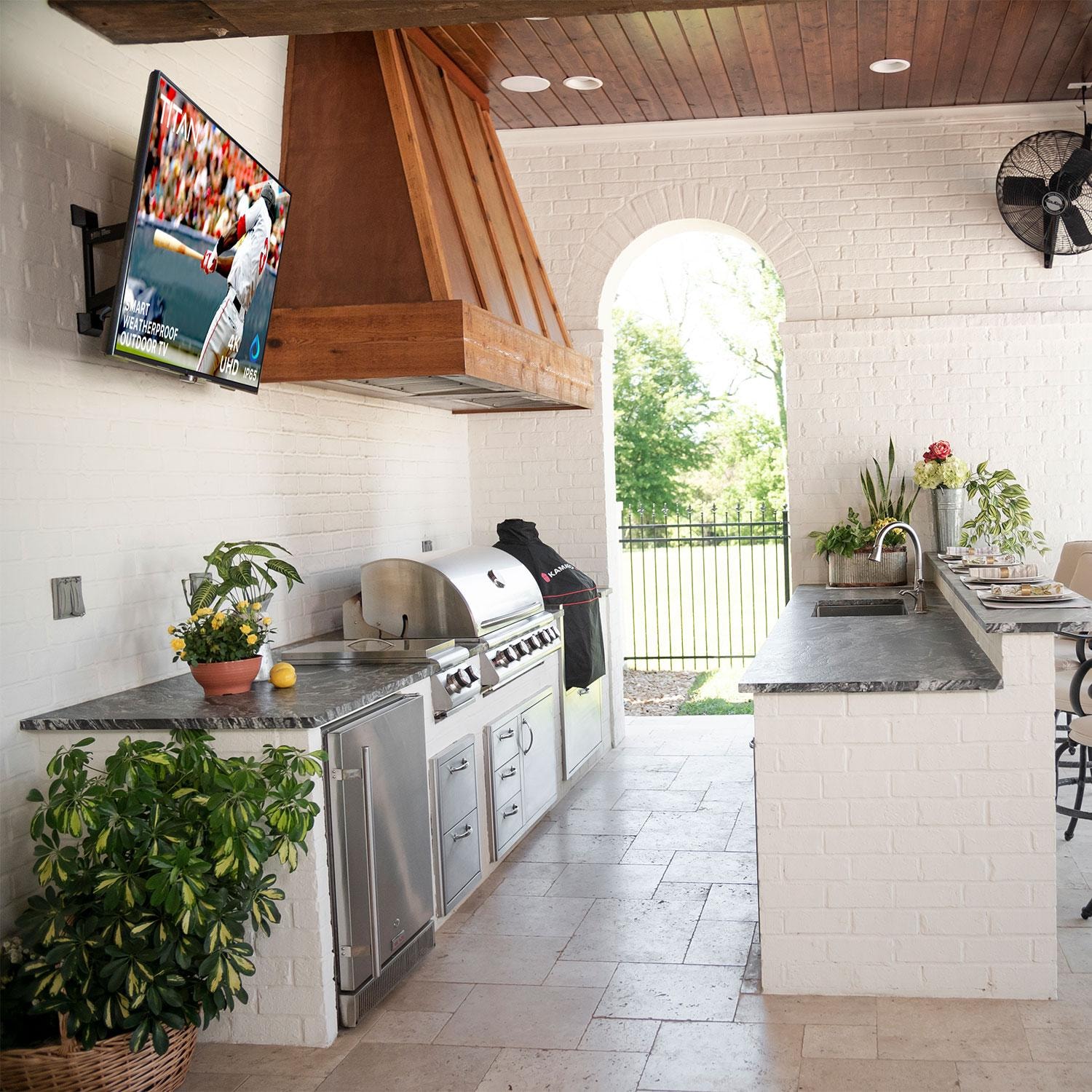 Titan CU8000 Series 85 Inch Full Sun UHD 4K Smart Outdoor TV - Mounted in Outdoor Kitchen - Lifestyle thumbnail