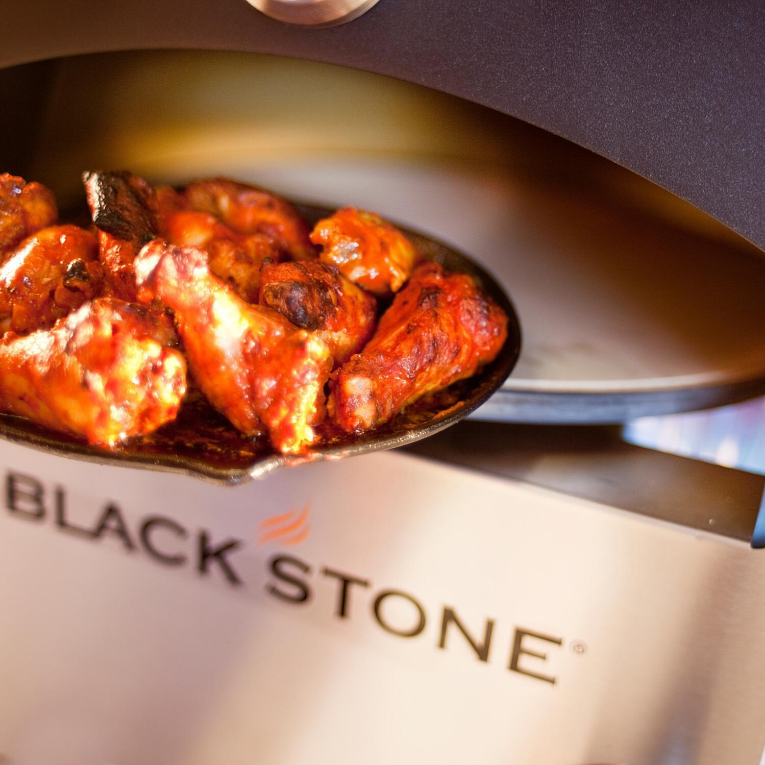 Blackstone Propane Gas Outdoor Pizza Oven On Cart - Cooked Wings thumbnail