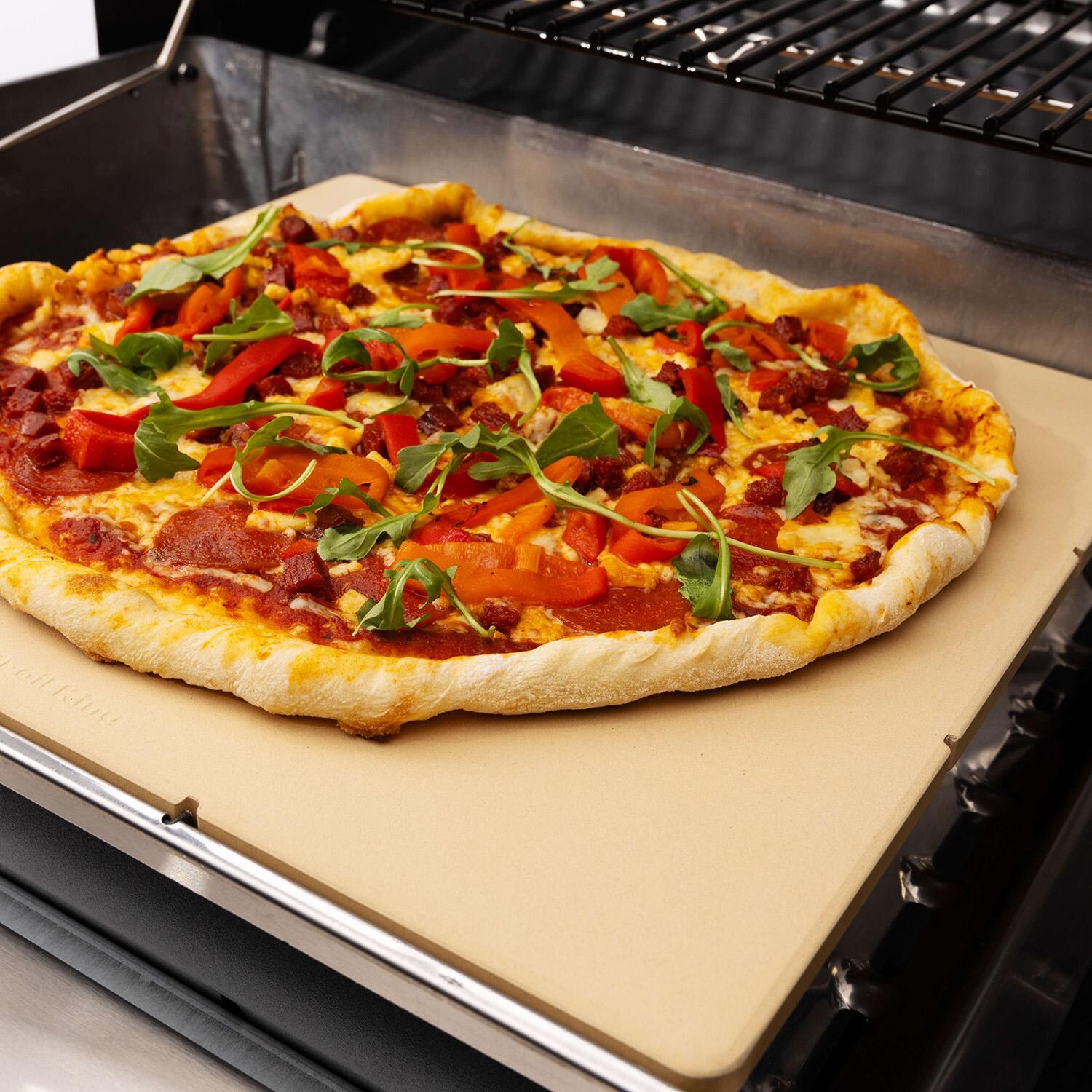 Broil King Monarch/ Royal Pizza Stone - 69821 - Pizza Angled - Lifestyle thumbnail