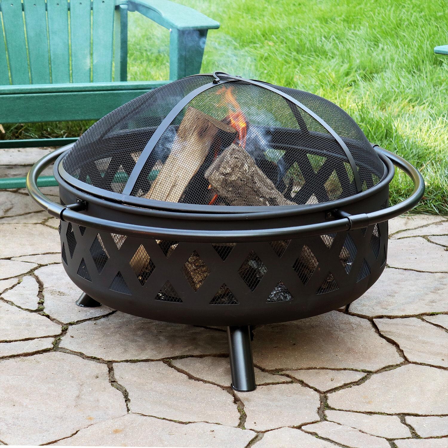 Ultimate Patio Crossweave 36 Inch Round Steel Wood-Burning Fire Pit in Black - Lakeside Patio Evening - Lifestyle thumbnail