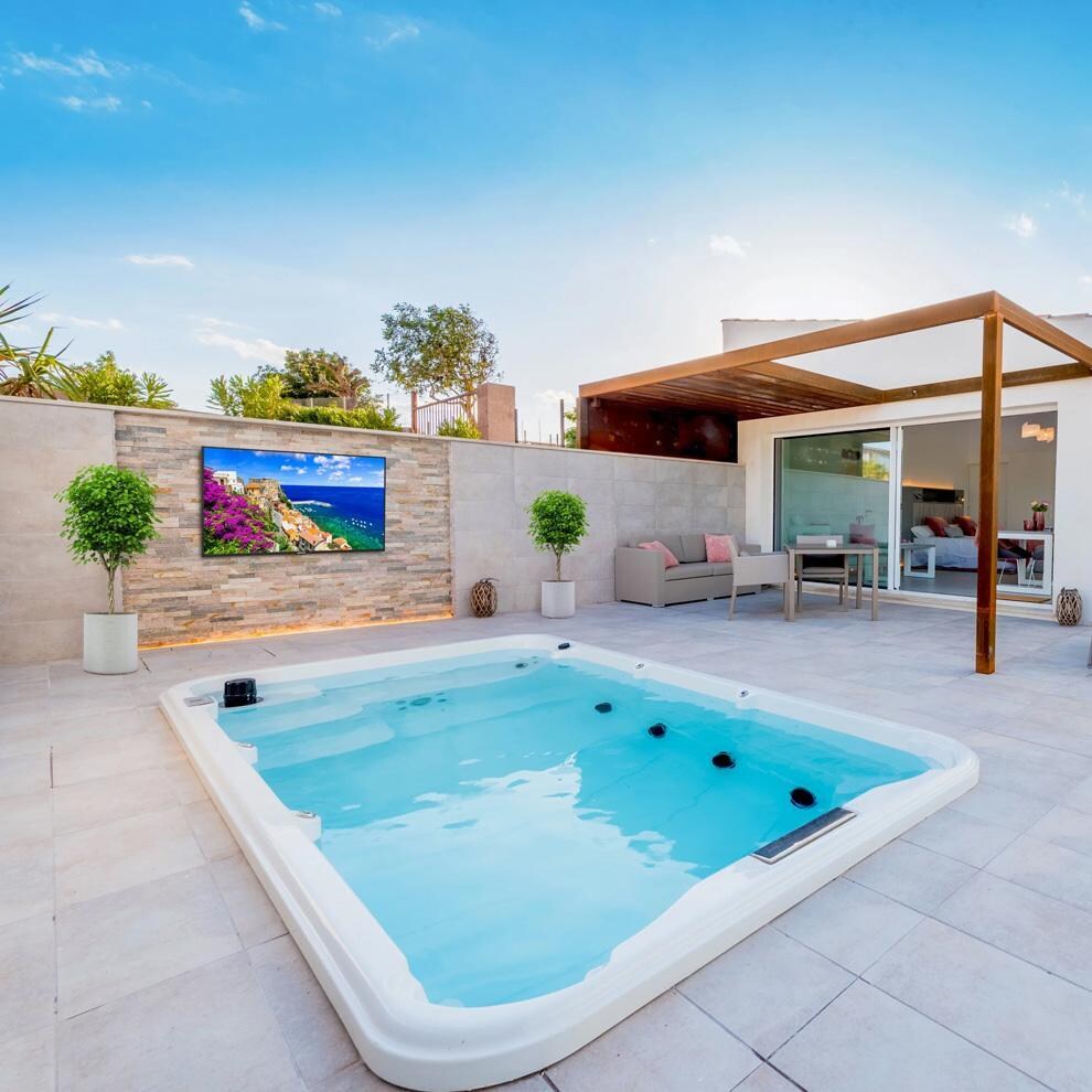 Neptune 65 Inch Full Sun 4K UHD LCD Outdoor Smart TV - WPTV654 - By The Pool 1 - Lifestyle thumbnail